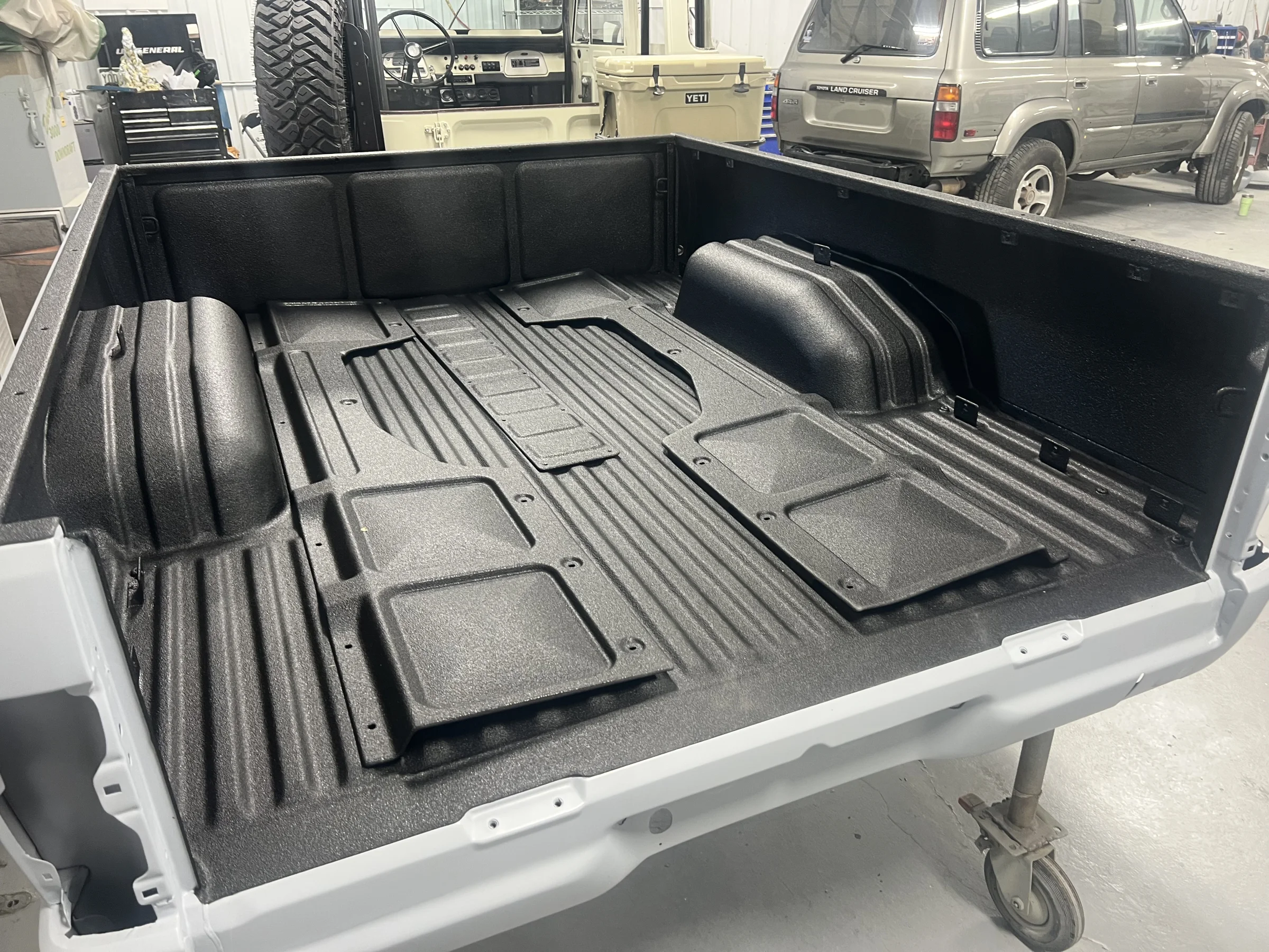 Repaired 1985 Toyota Pickup bed protected with fresh black bedliner