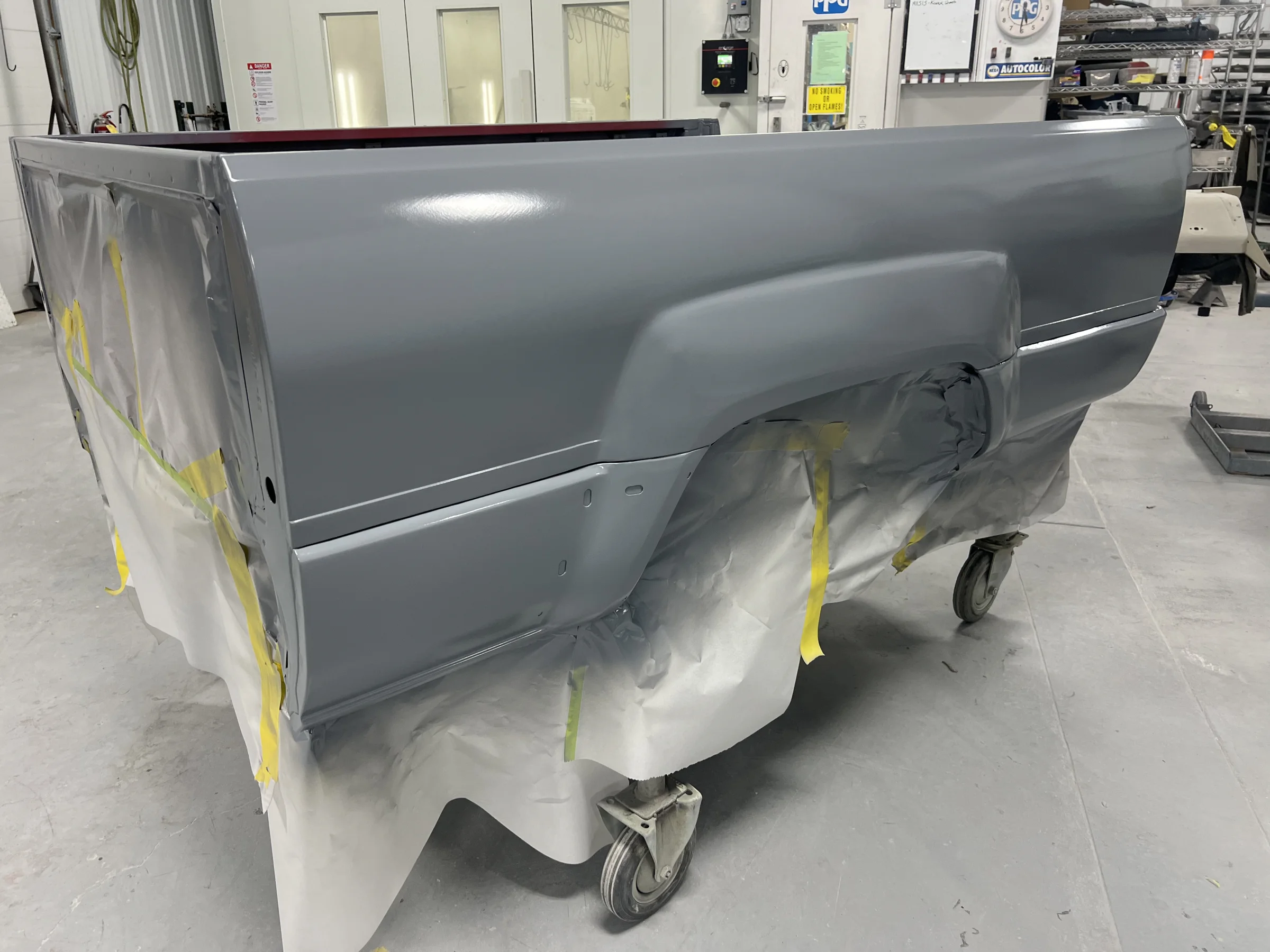Reconstructed Toyota Pickup bed panels in primer before refinishing