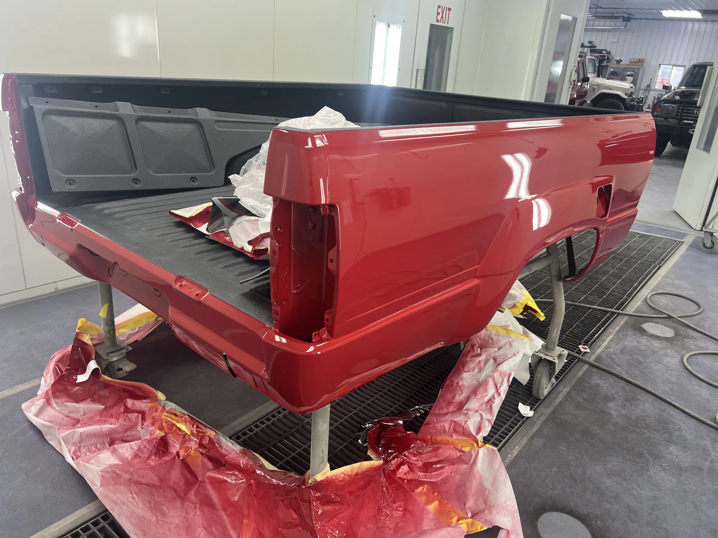 Reconstructed Toyota Pickup bed refinished in matching red paint