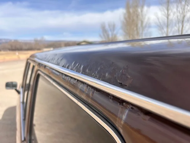 Severe rust spreading through an FJ60 roof and rain gutter seam