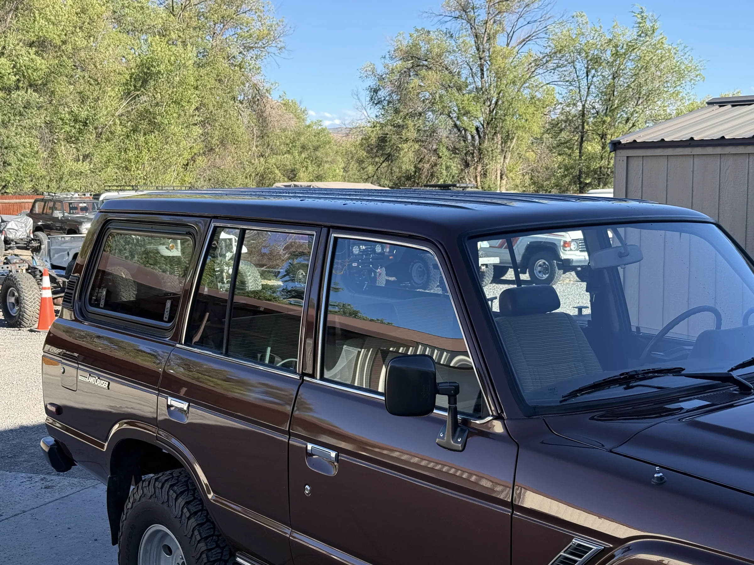 Completed donor roof and gull-wing windows on a brown FJ60