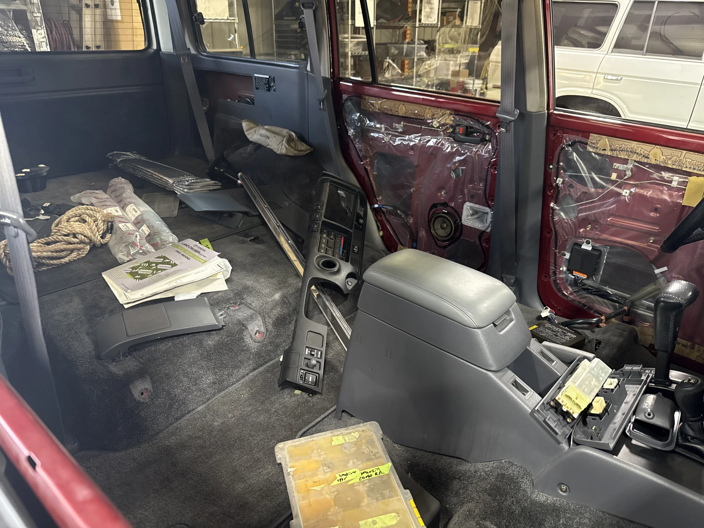 Interior of the 80 Series Land Cruiser during the OEM-style cloth and Dynamat installation