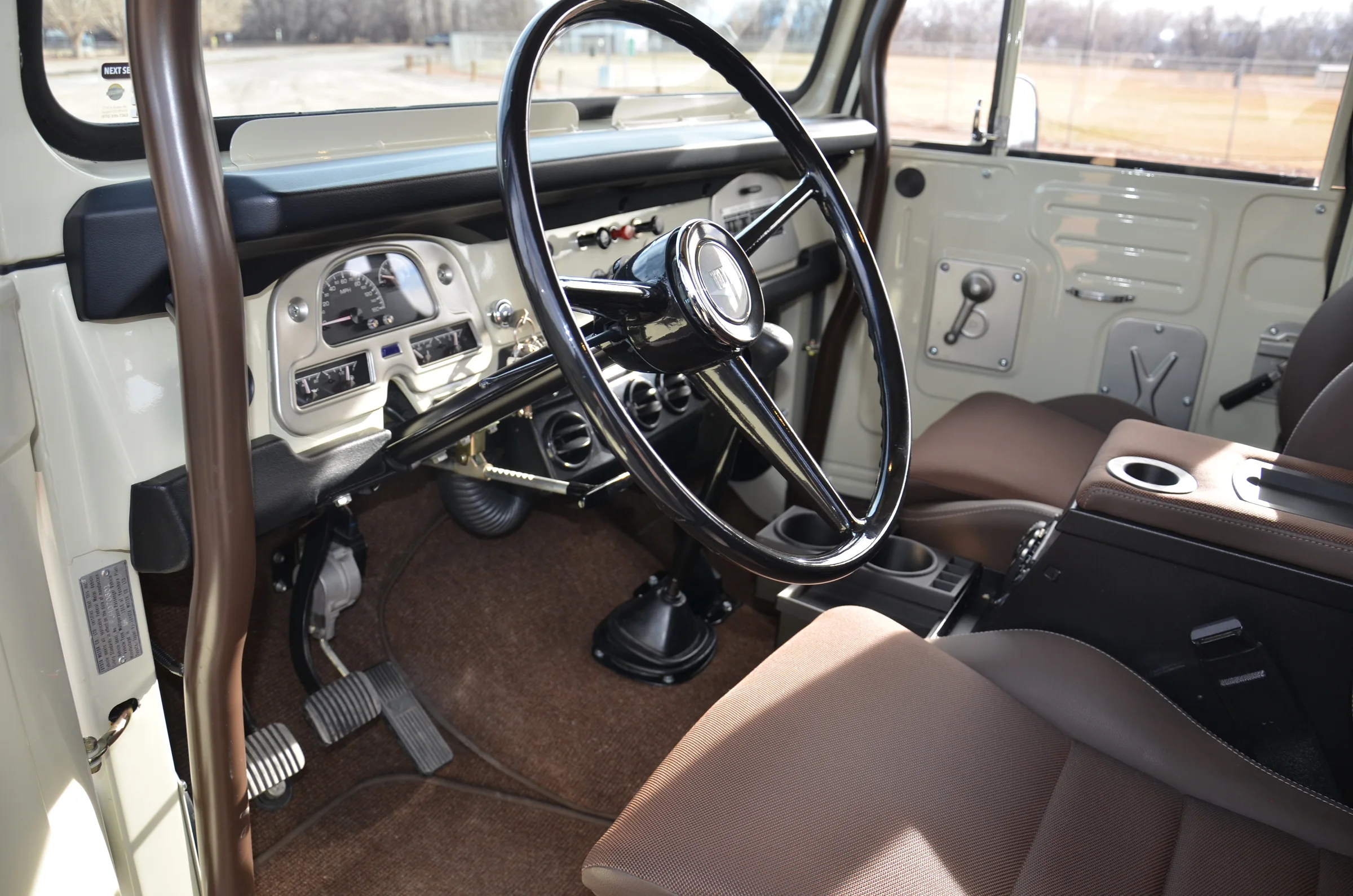 Driver area with custom carpet covering the FJ40 sound deadener