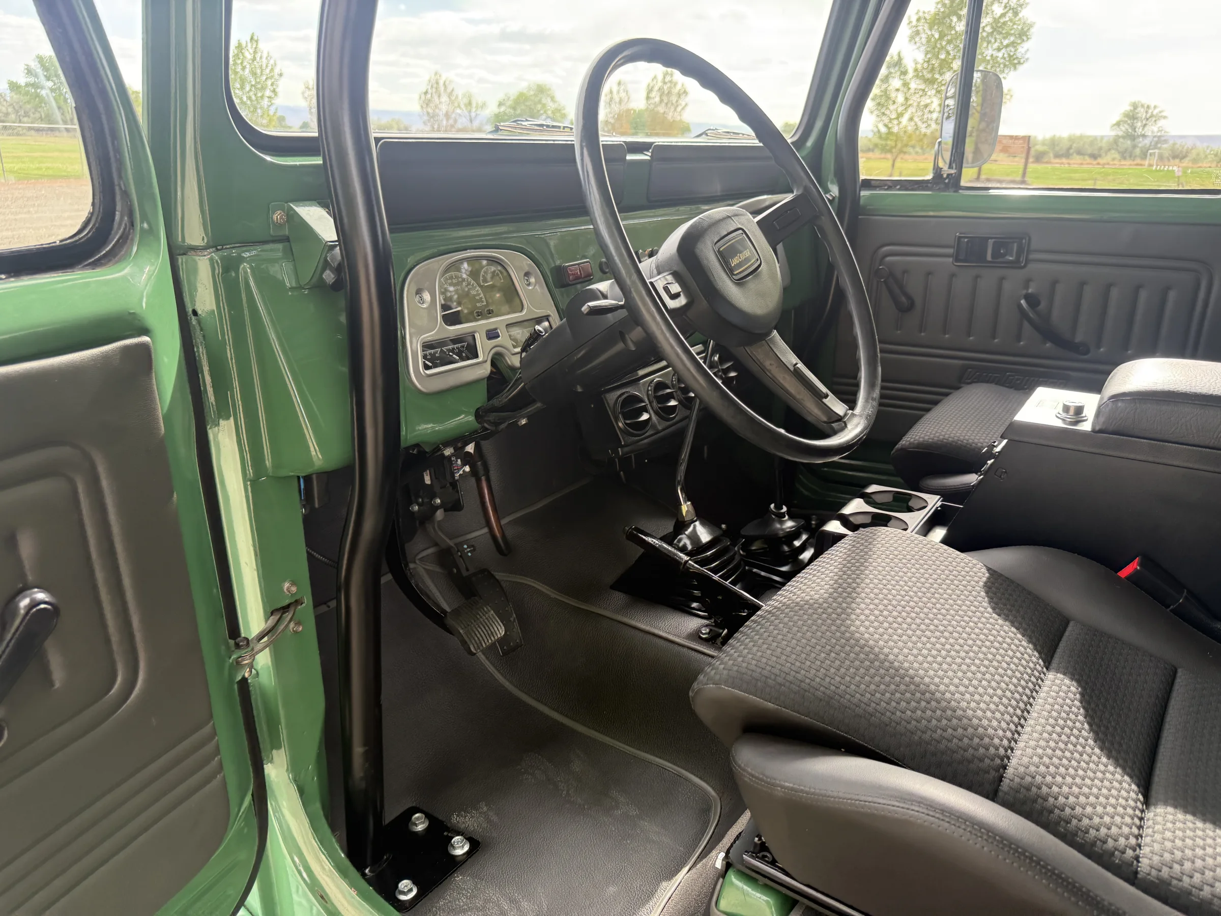 Renewed FJ43 cabin with Dakota Digital instrumentation and custom controls