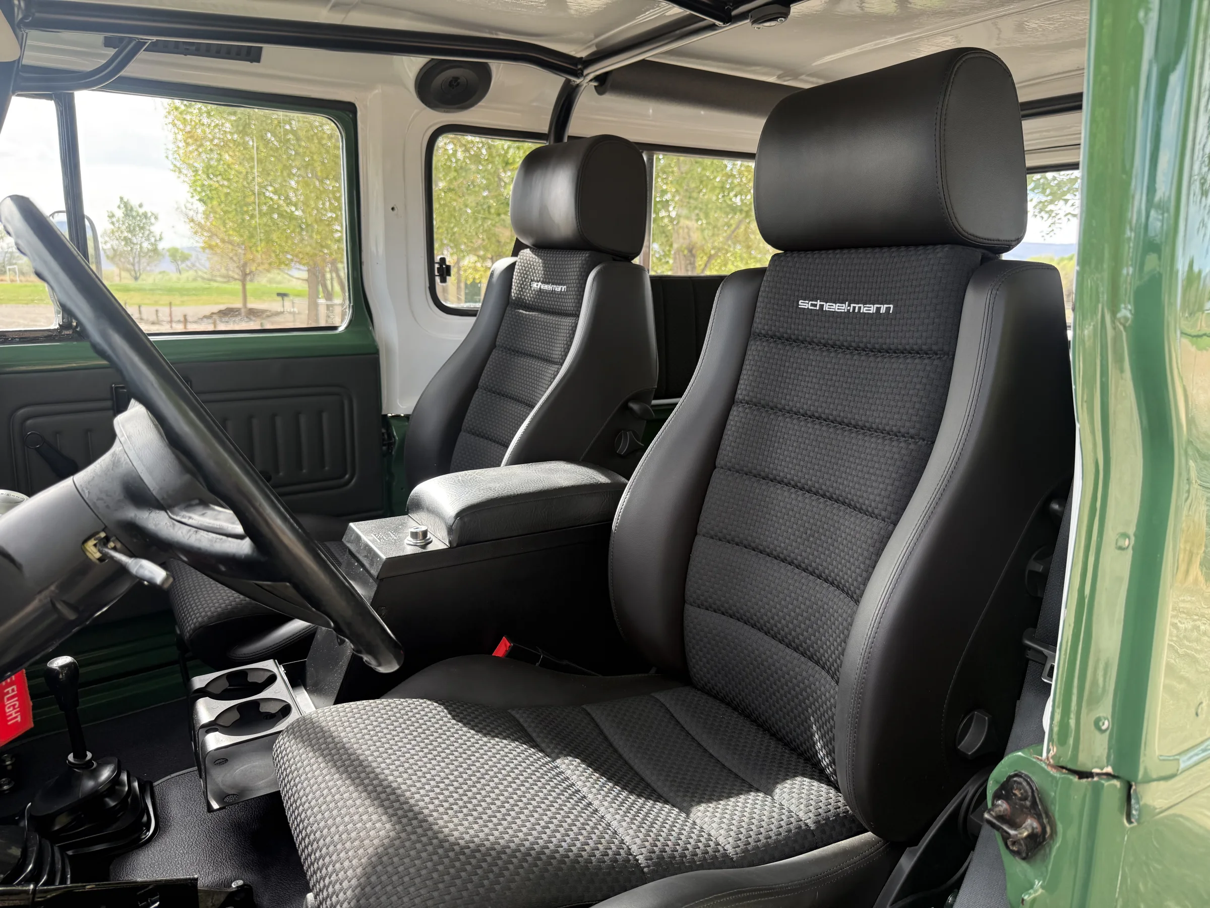 Scheel-Mann front seats installed in the custom green FJ43