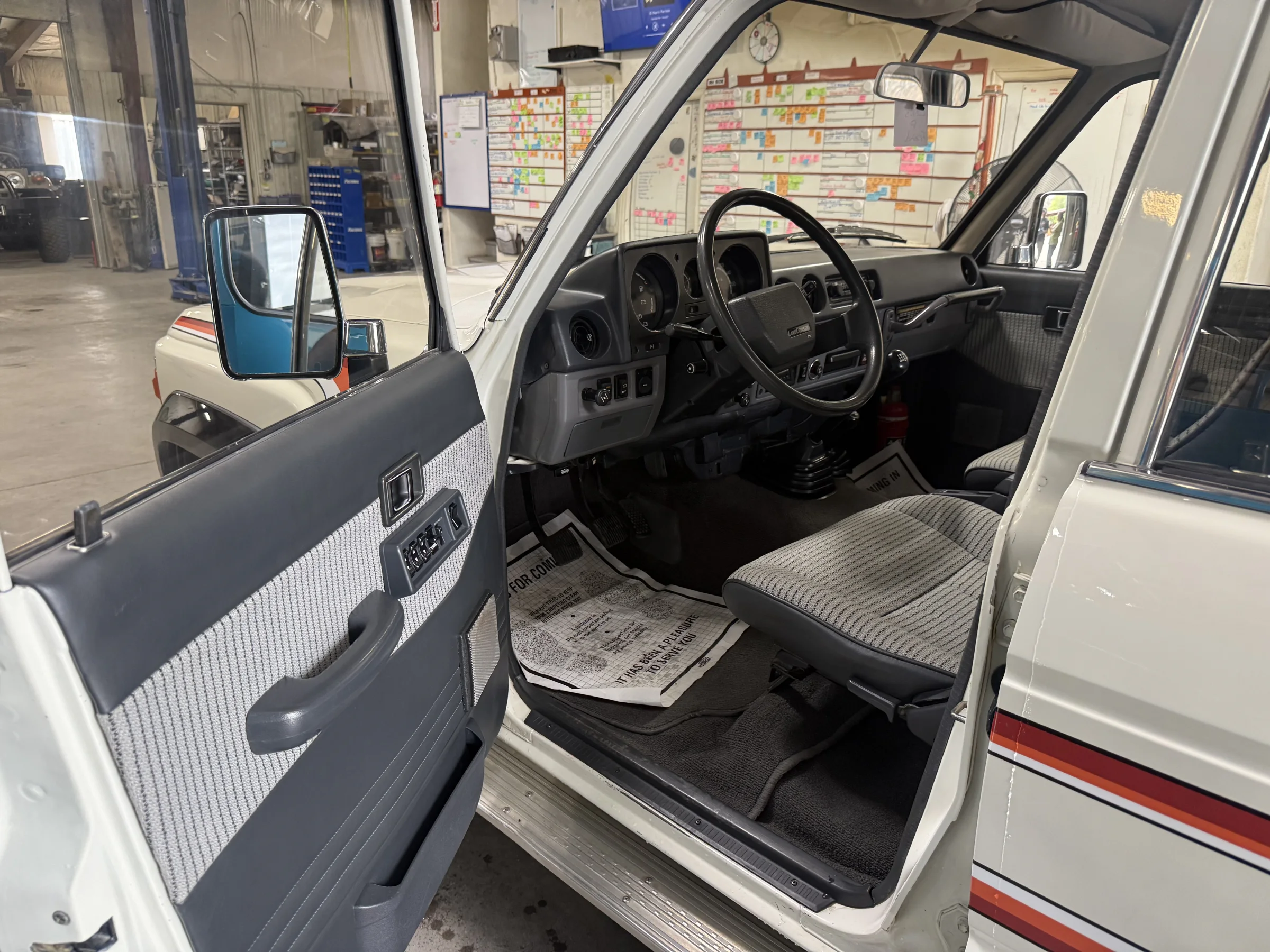 Front cabin of the FJ62 with its complete OEM replica-cloth interior