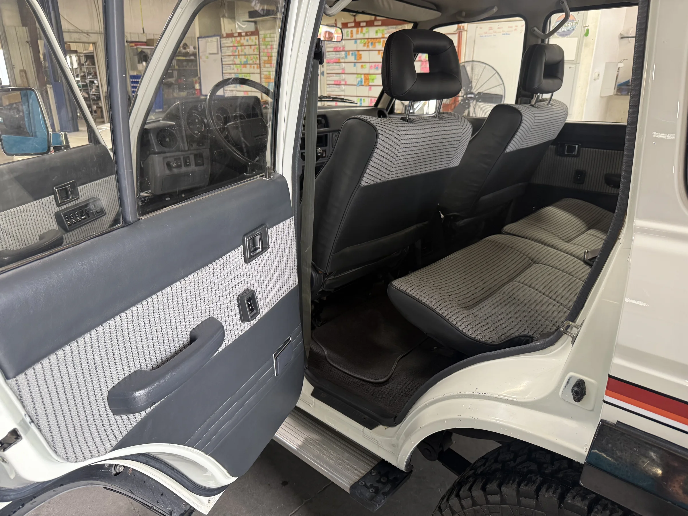 Matching rear seat and door panels in the renewed FJ62 interior