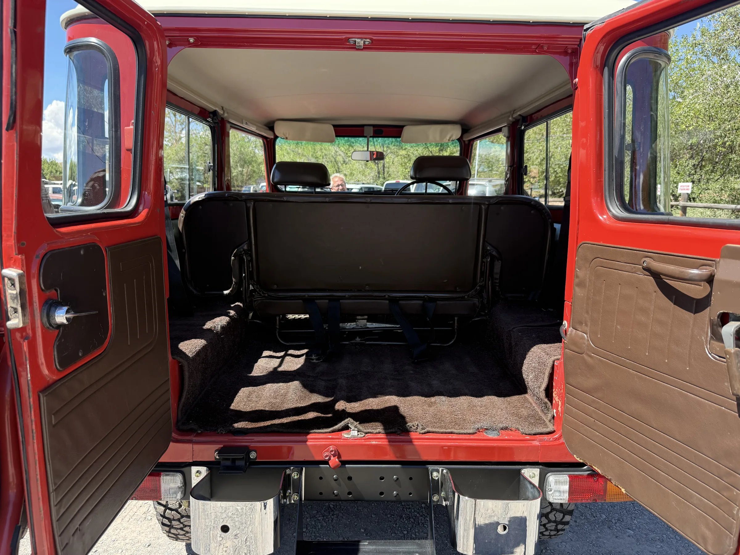Rear cargo area and refinished hardtop interior of a red BJ46