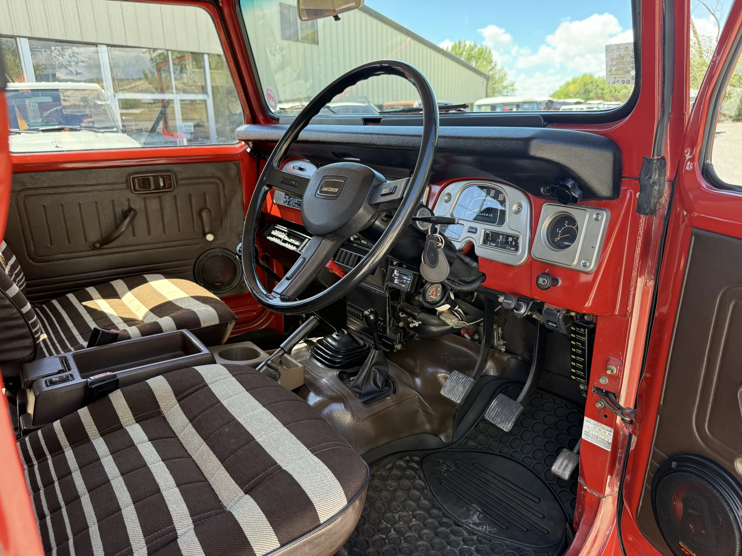 Right-hand-drive dashboard and zebra stripe front seat in a BJ46
