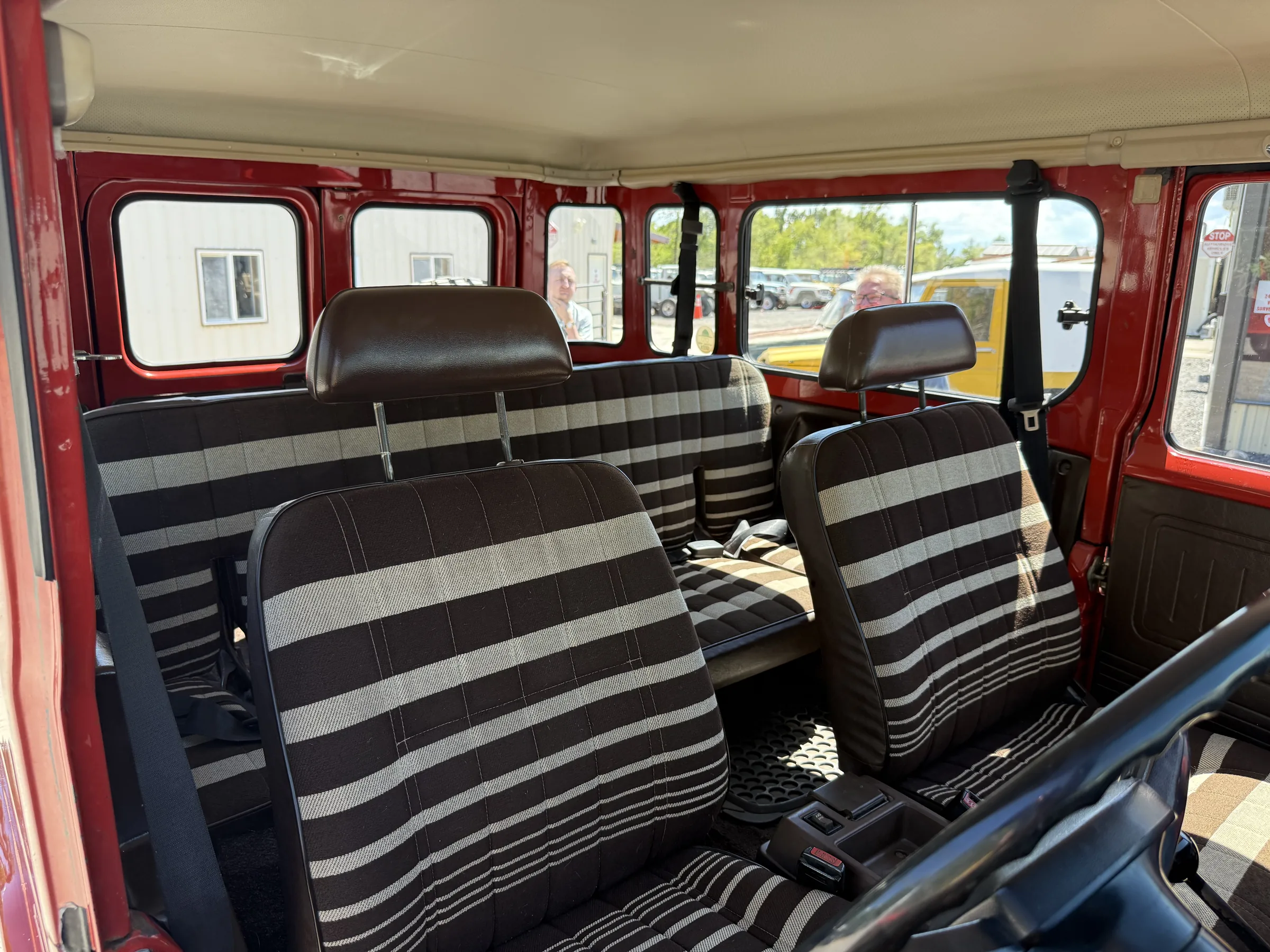 Zebra stripe seating and hardtop interior of a red BJ46