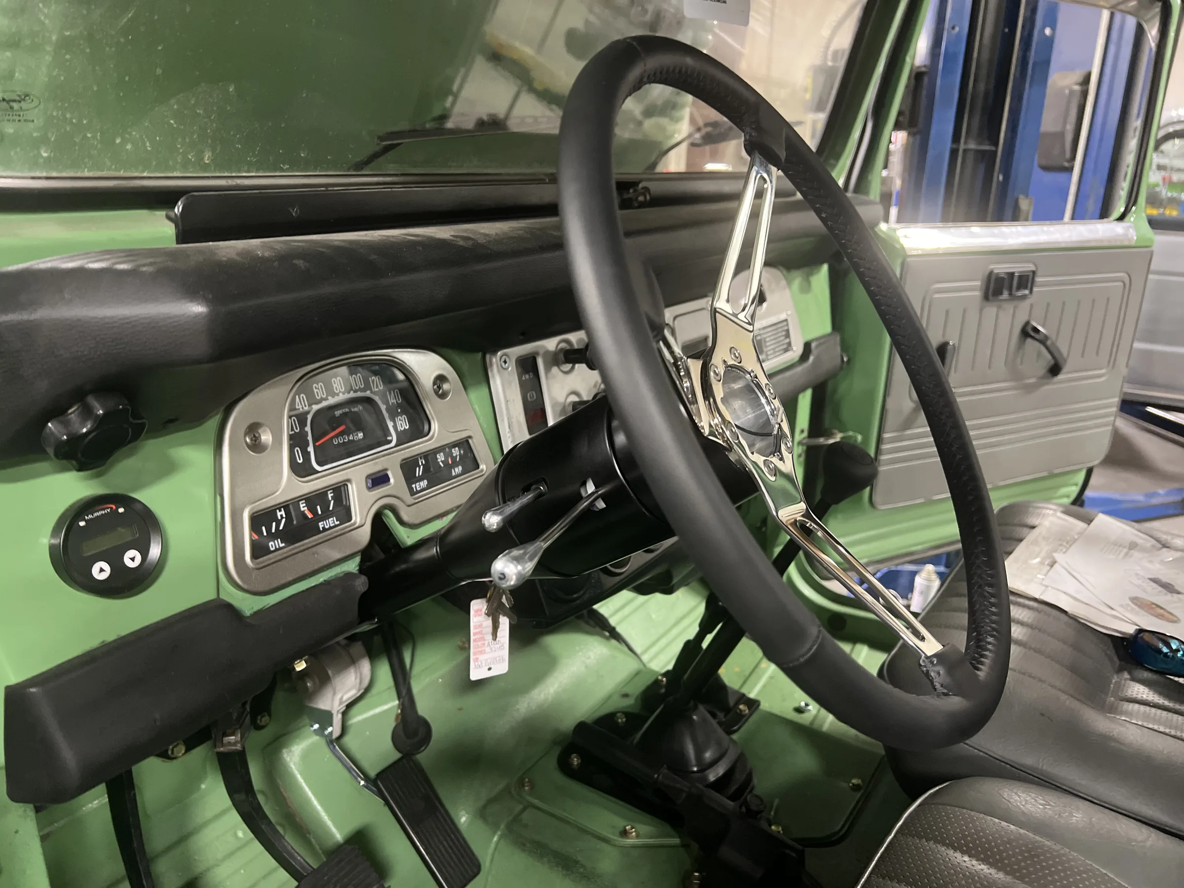 Flaming River steering column and updated steering wheel in the FJ45 cab