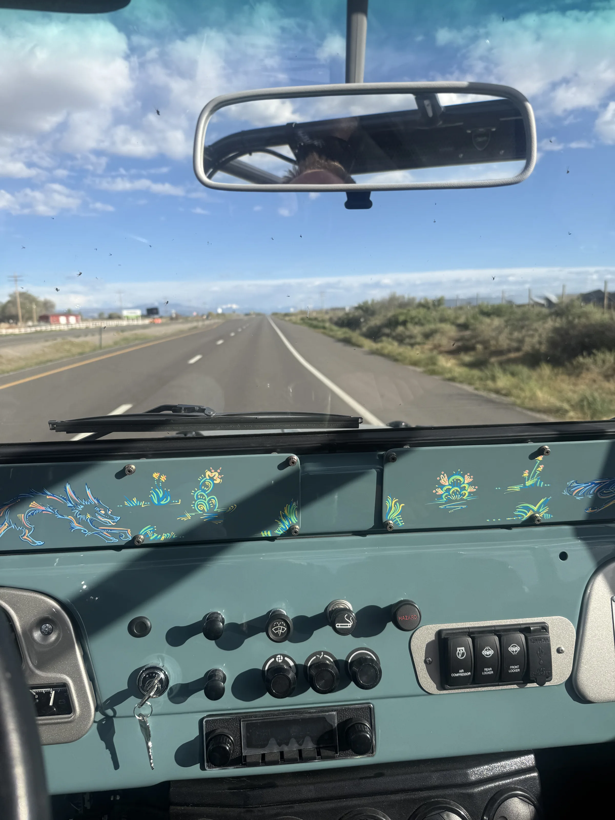 Driver view of the FJ40 dashboard after its authentic-style redesign