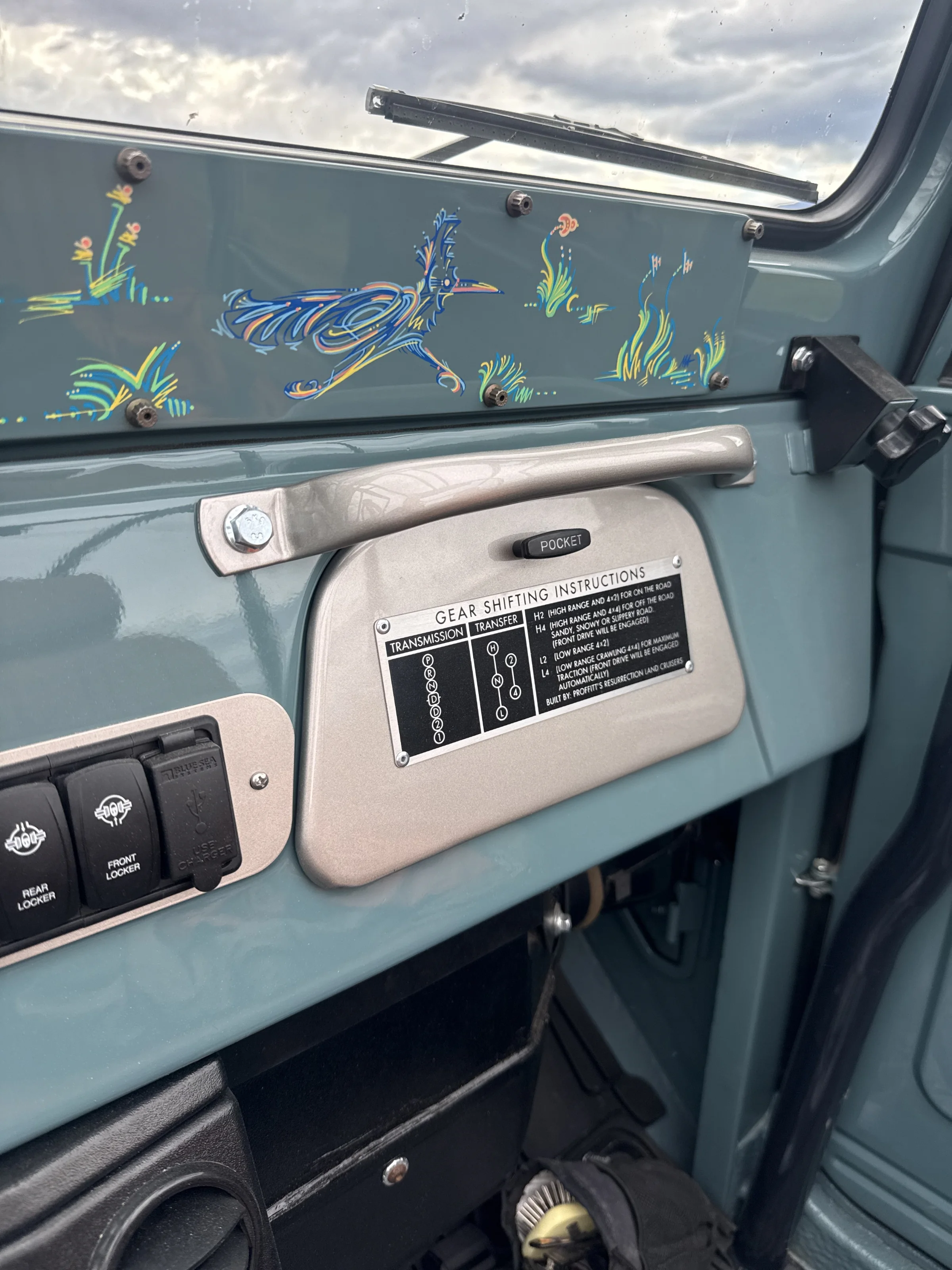 Passenger side of the redesigned FJ40 dashboard with custom painted details