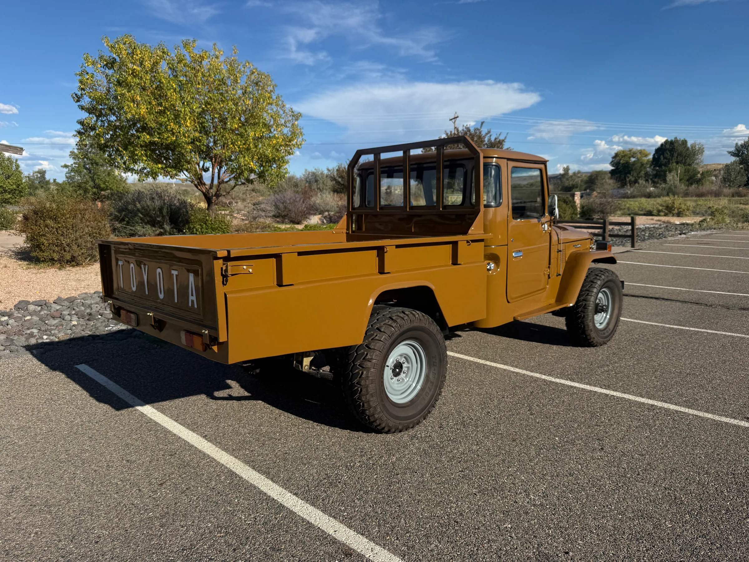 Rear passenger-side view of the 1978 FJ45 pickup and Toyota tailgate