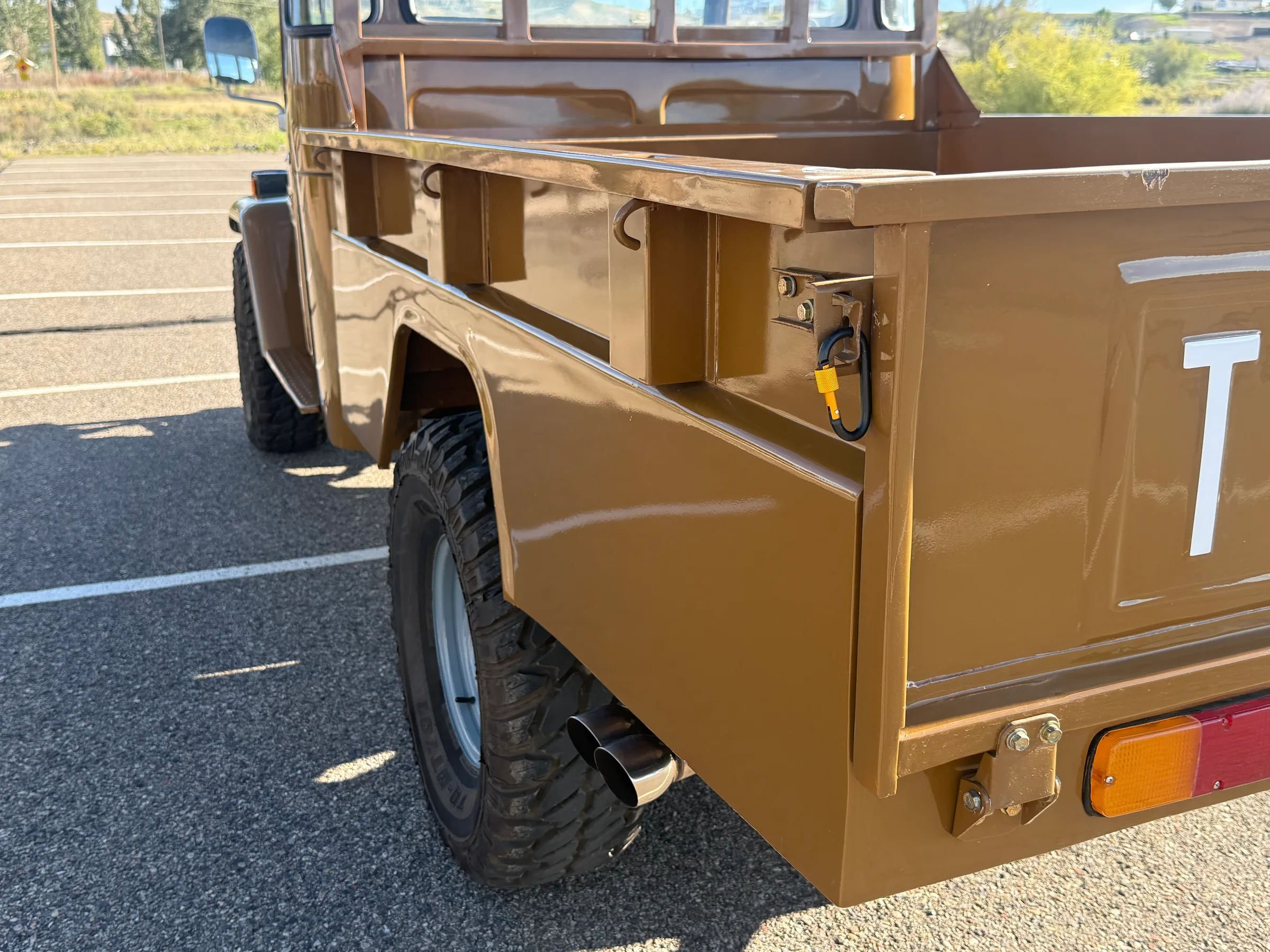 Driver-side rear bed corner, latch, and taillight on the FJ45