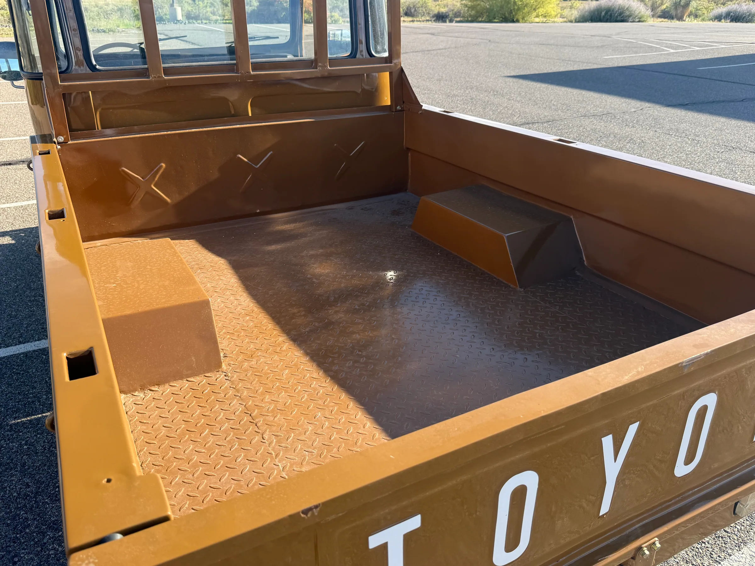 FJ45 pickup bed viewed over the open Toyota tailgate