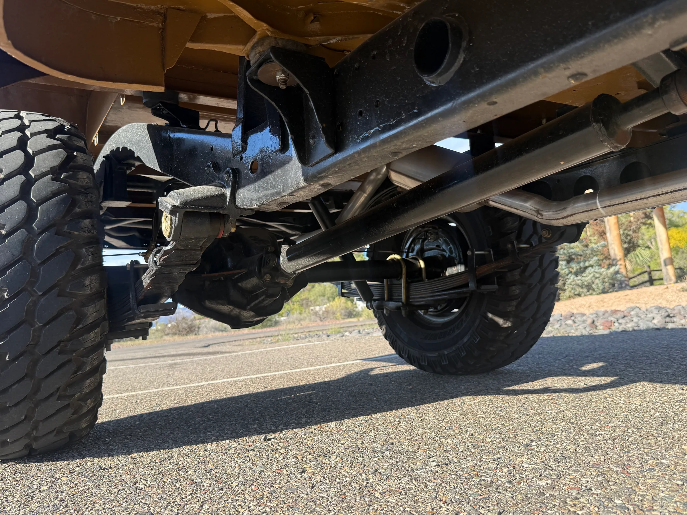 Frame rails and suspension beneath the 1978 FJ45 pickup