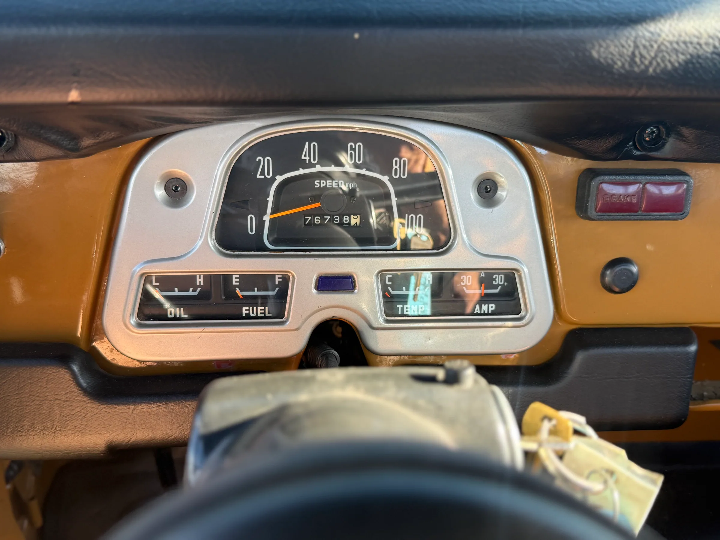 Instrument cluster showing 76,738 miles on the 1978 FJ45