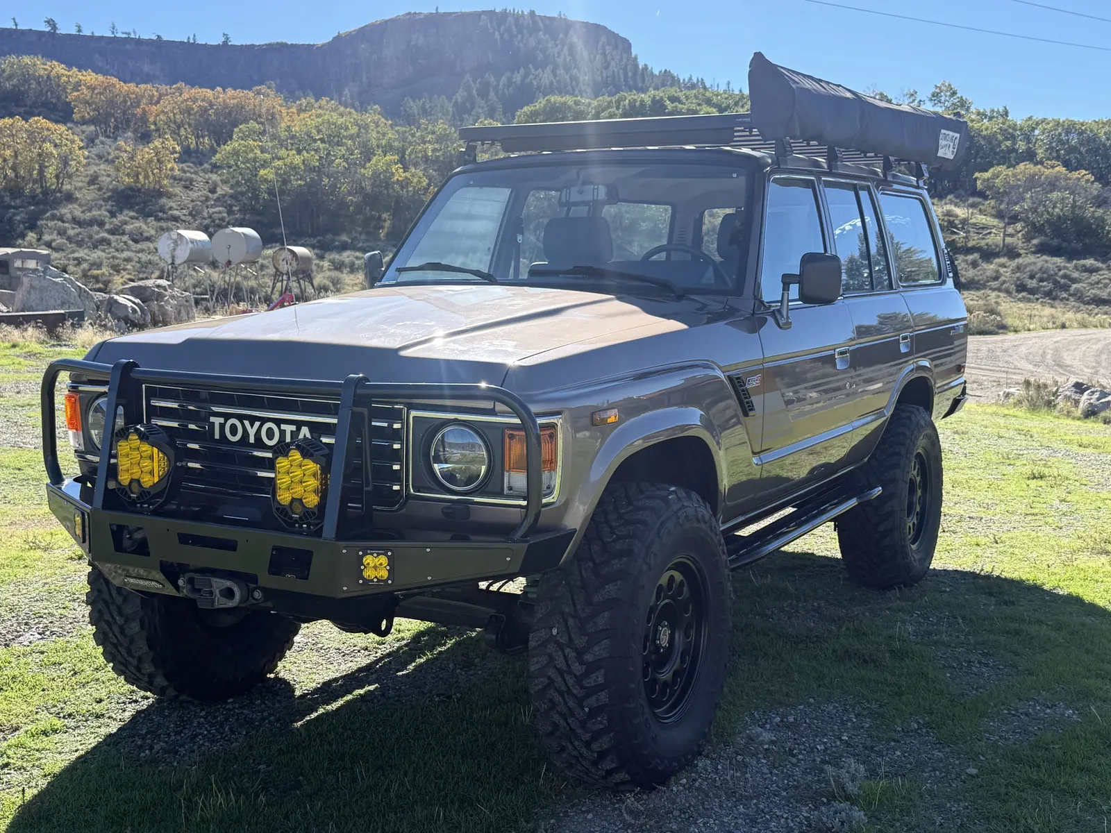 Front view of the FJ60 with Dissent bull bar, Warn winch, and Baja Designs lights