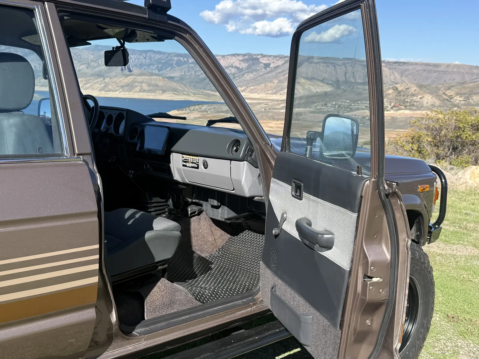 Open front passenger door and dashboard of the 1987 FJ60