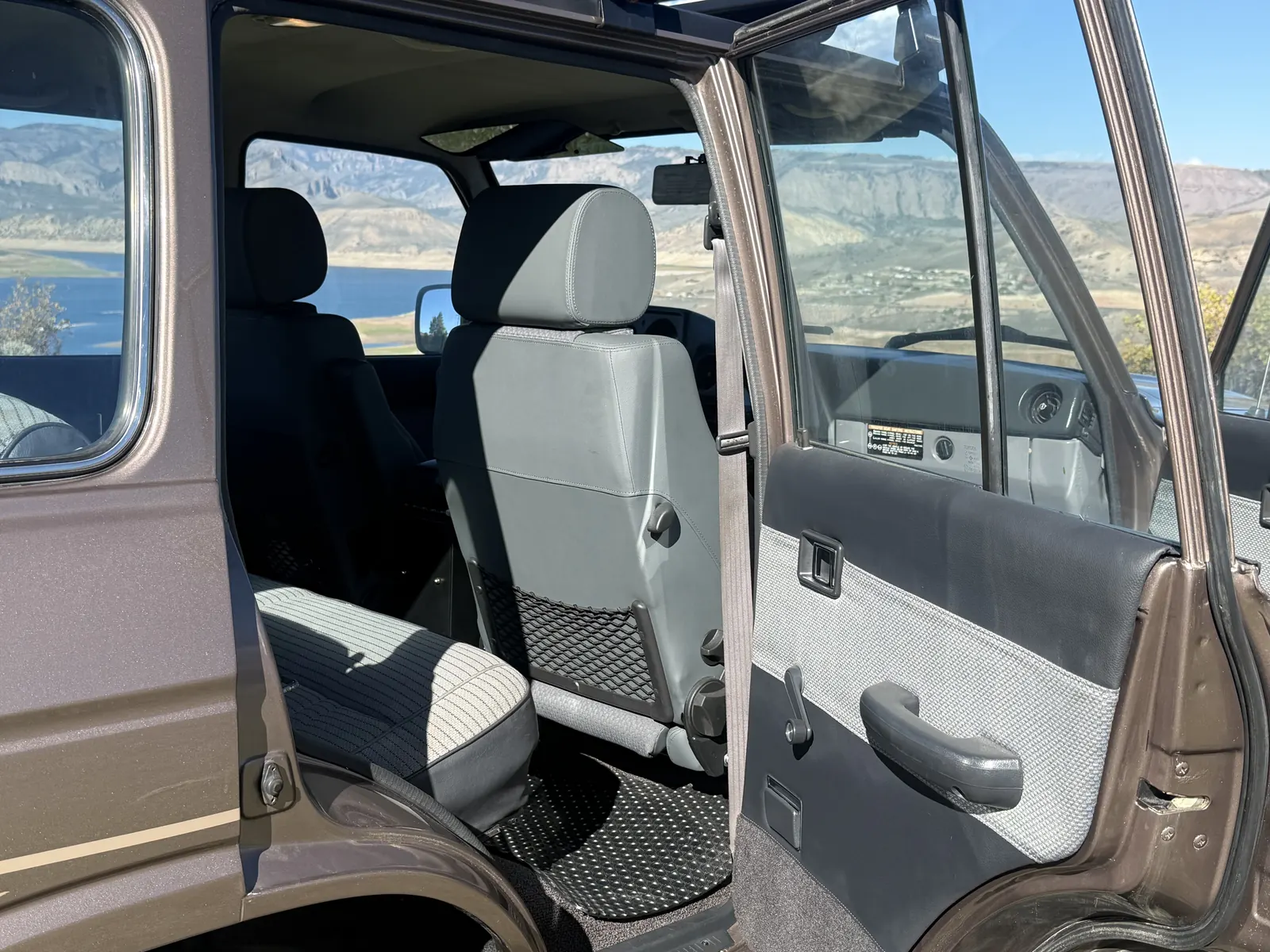 Open rear passenger door and cabin of the 1987 FJ60