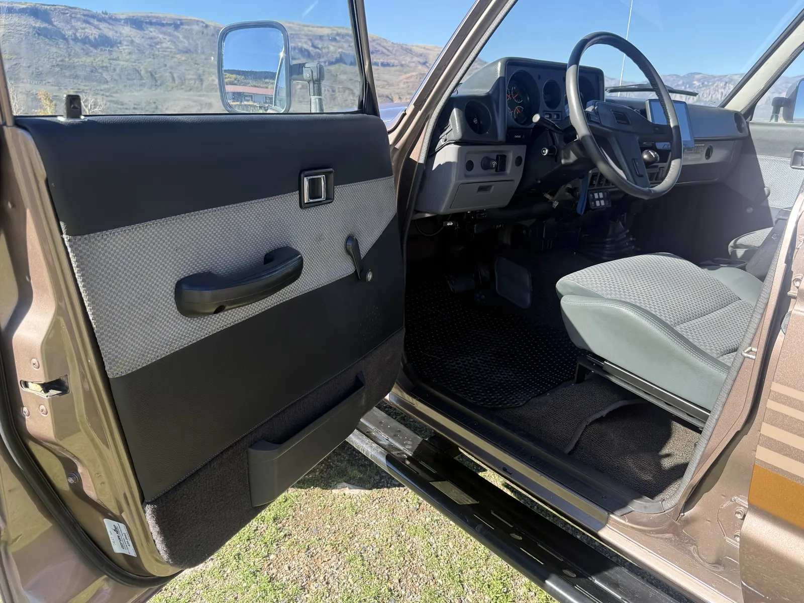 Open driver door and Scheel-Mann driver seat