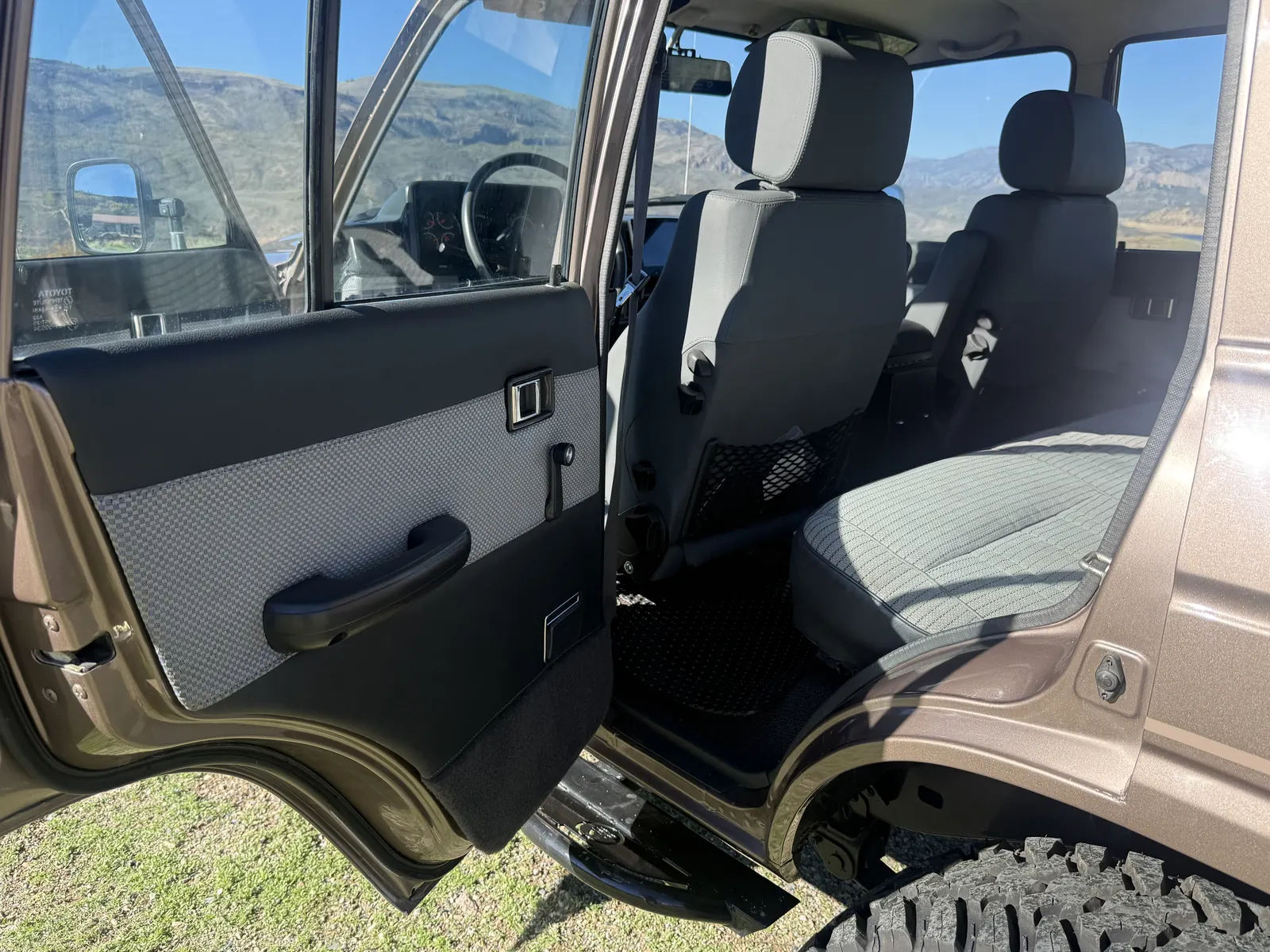 Rear driver-side door panel and front seats in the 1987 FJ60