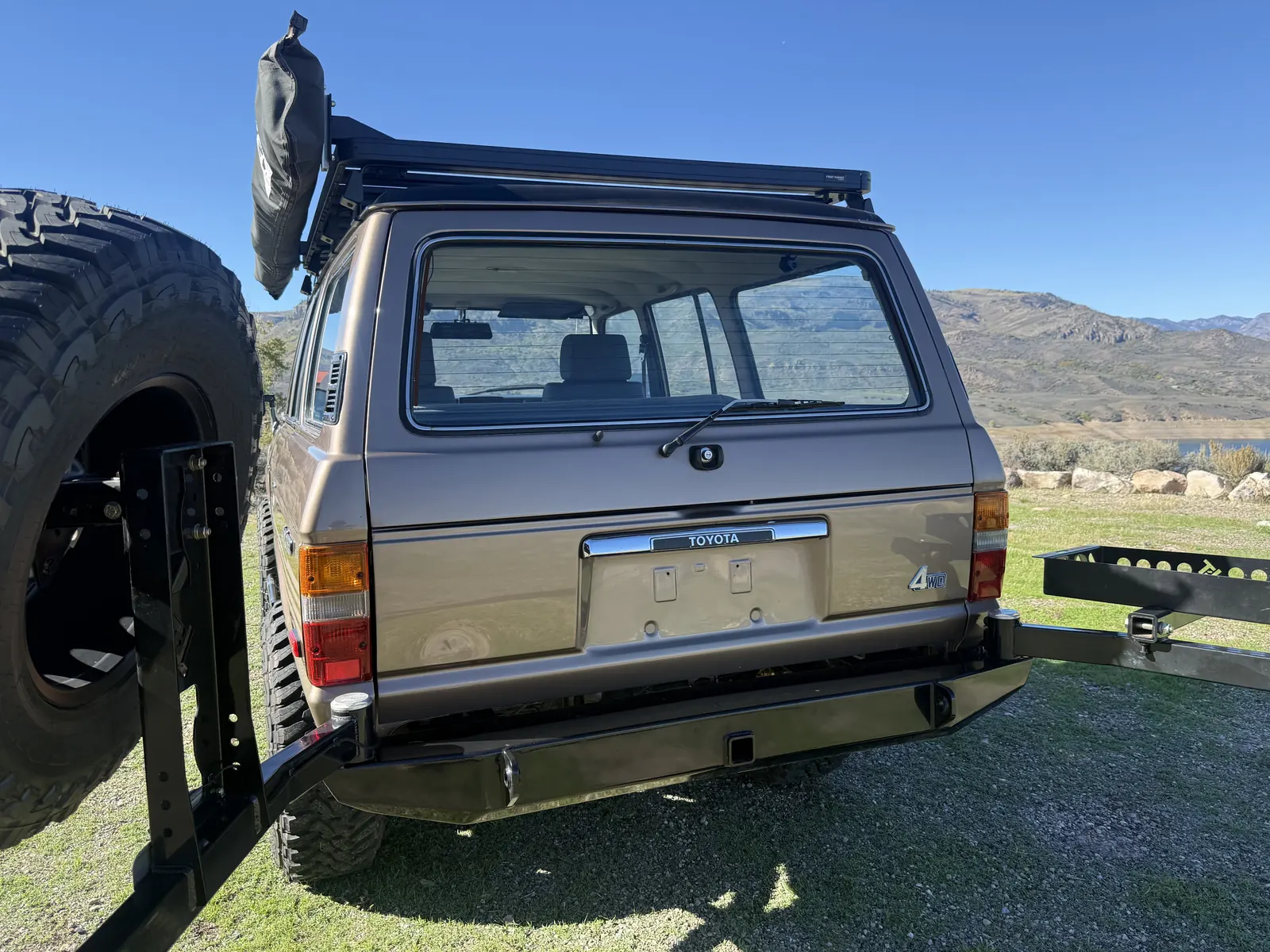 Rear of the FJ60 with Trail Tailor bumper and open spare tire carrier