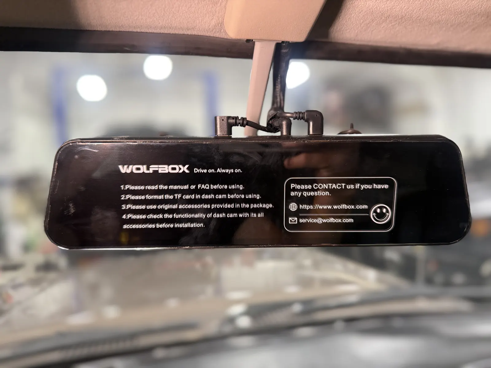 Forward- and rear-facing camera display mounted at the rearview mirror