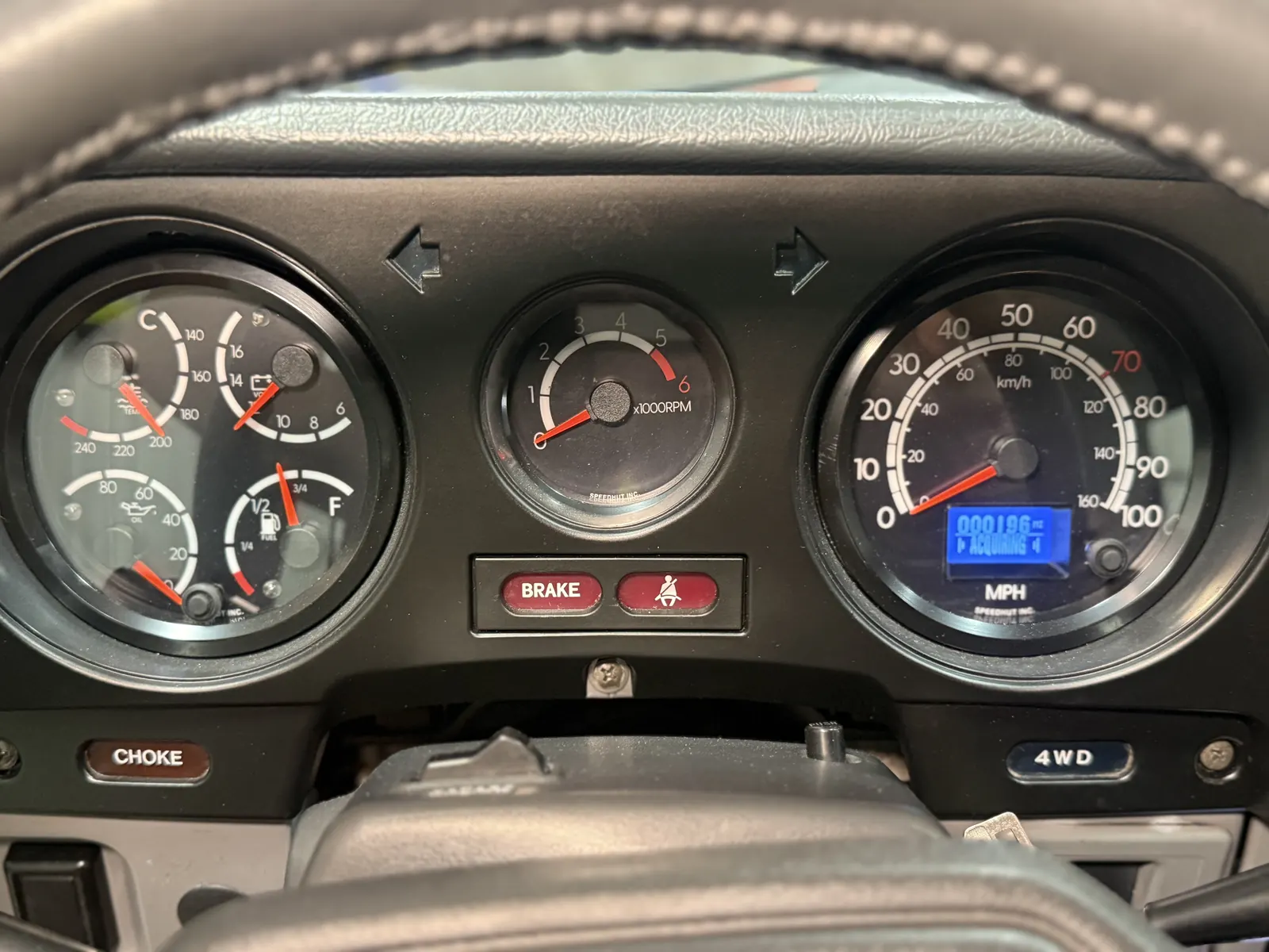 Speedhut digital gauges in the FJ60 instrument cluster