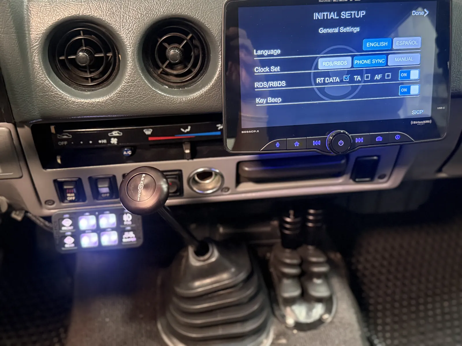 Dashboard controls, head unit, and switch panel in the FJ60