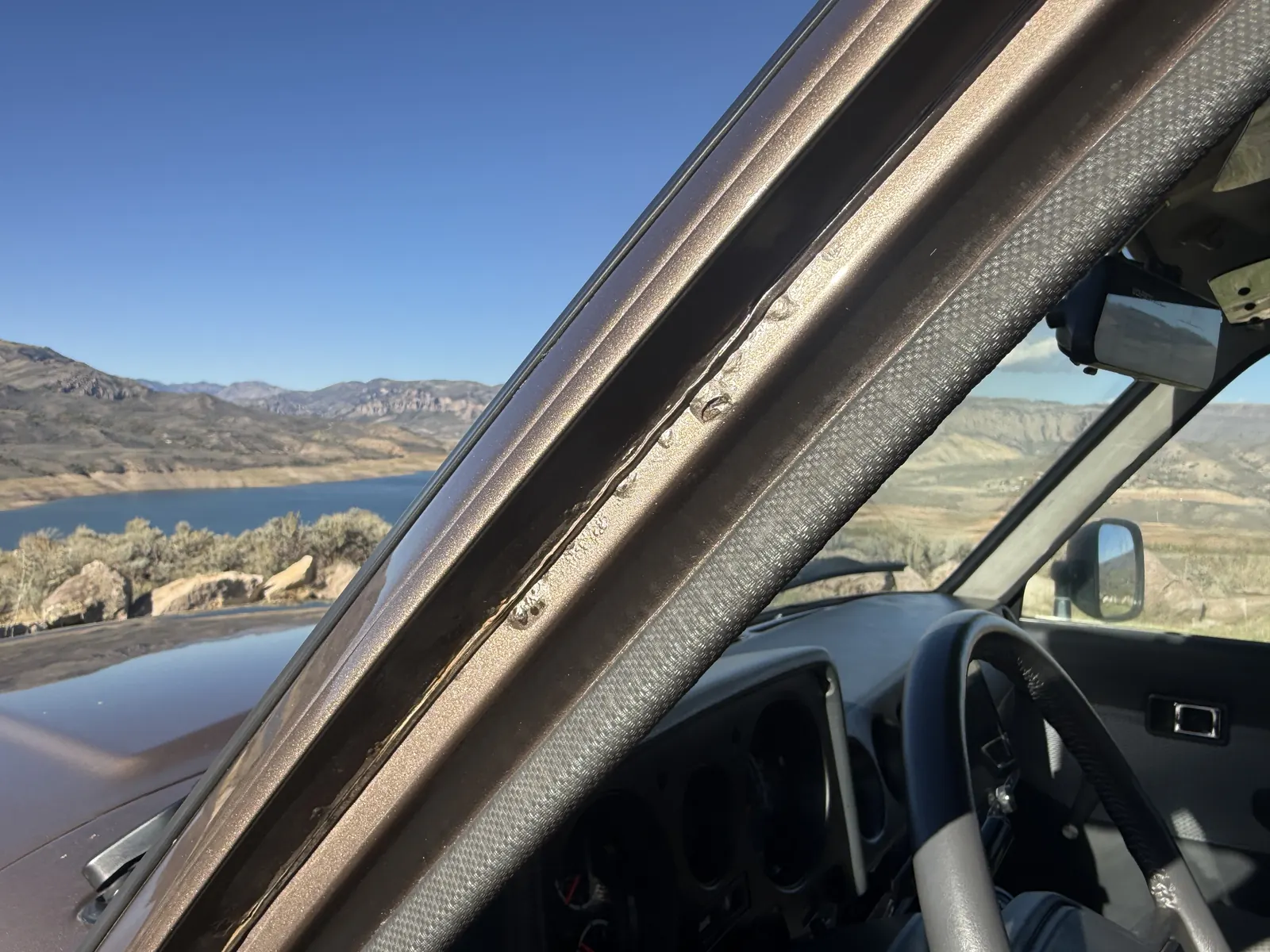 Driver-side A-pillar and windshield trim detail
