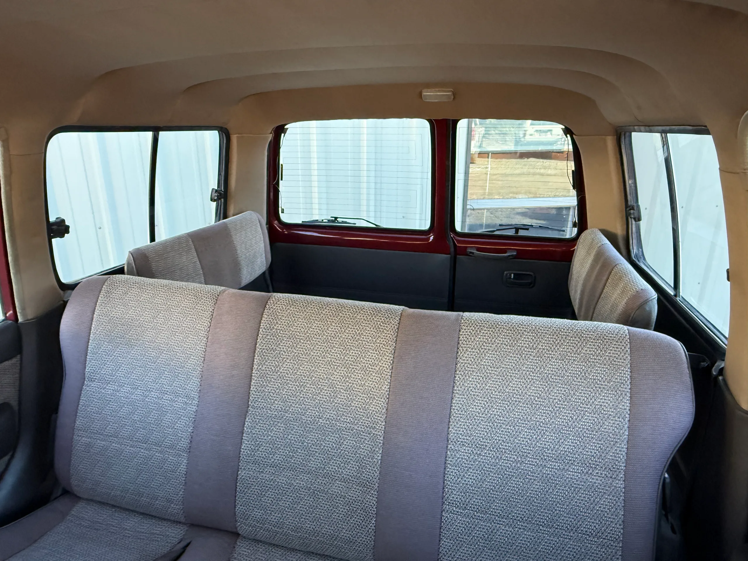 Gray cloth second-row bench seat and rear cabin of the FJ80