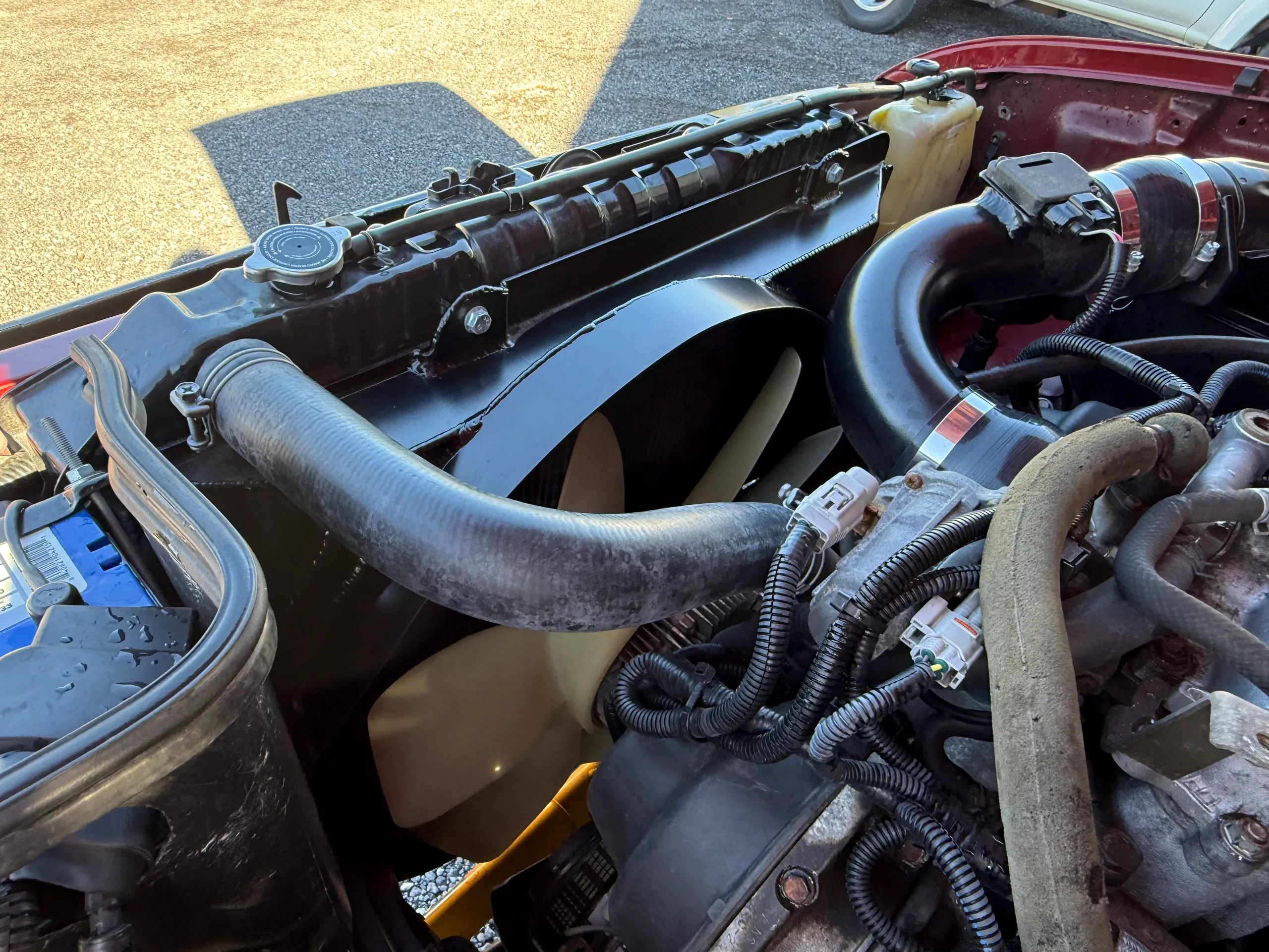 Radiator, fan, and cooling-system detail in the FJ80 engine bay