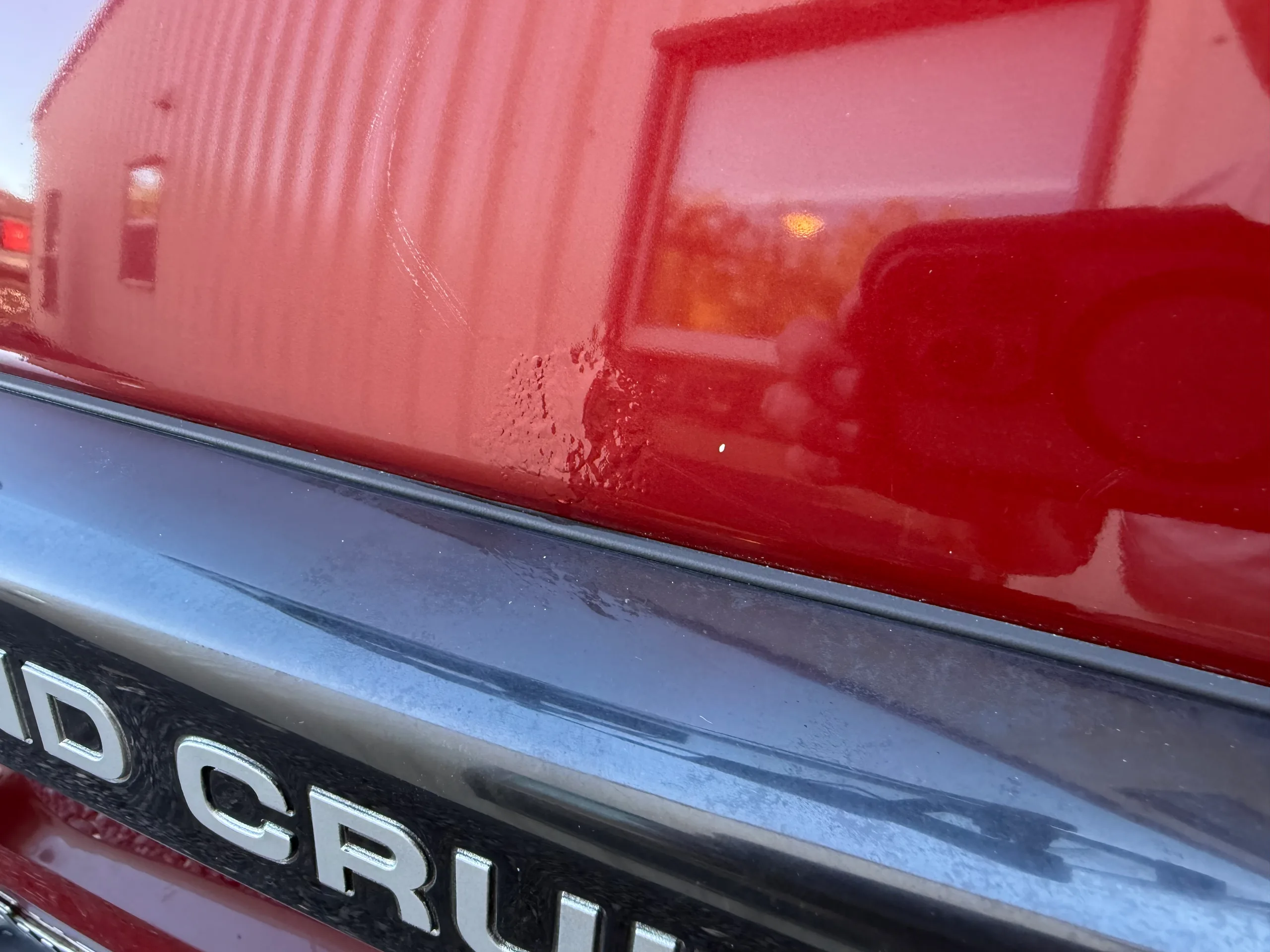 Cosmetic paint blemish above the rear bumper of the FJ80