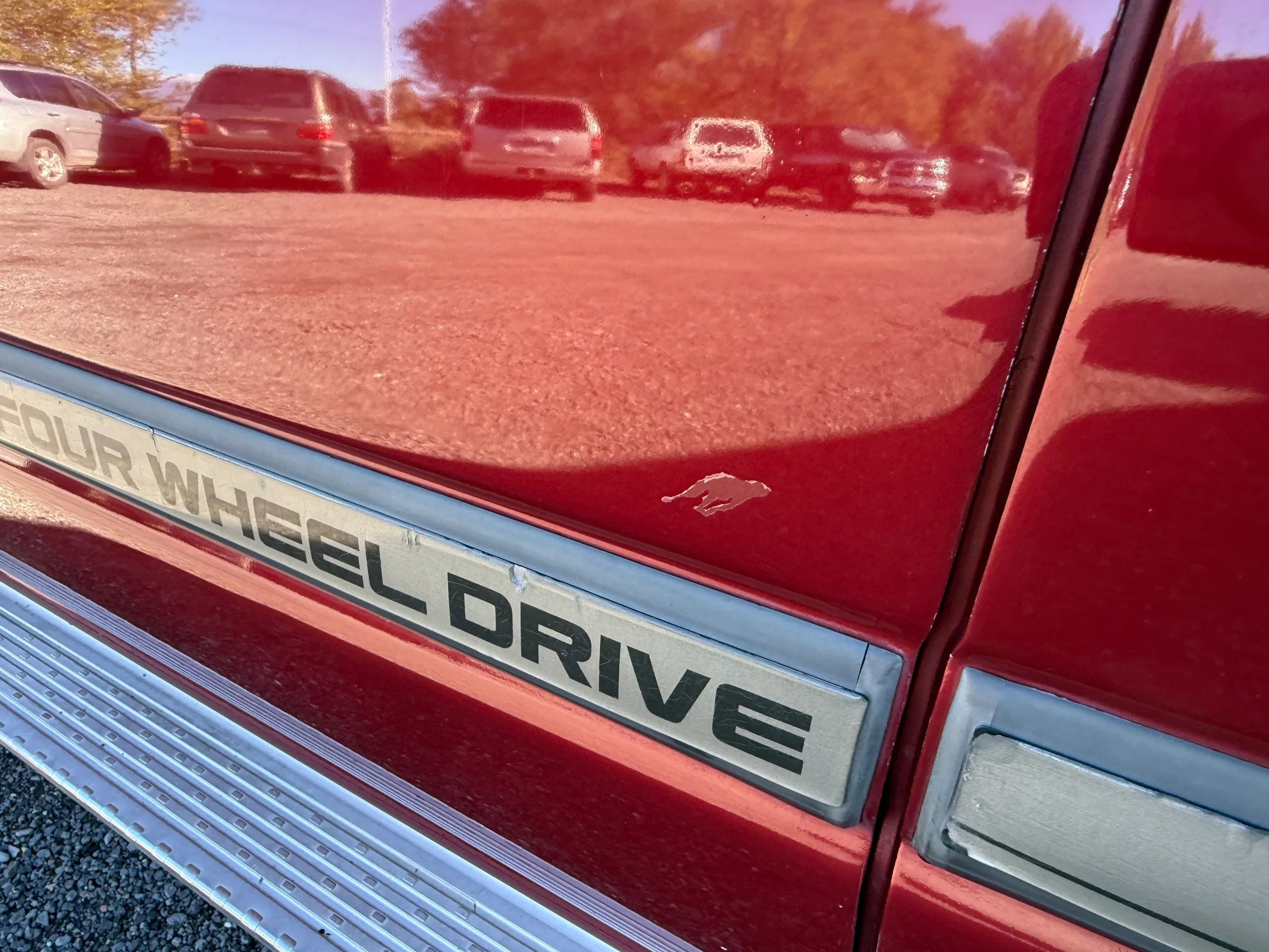 Paint blemish above the four-wheel-drive side molding