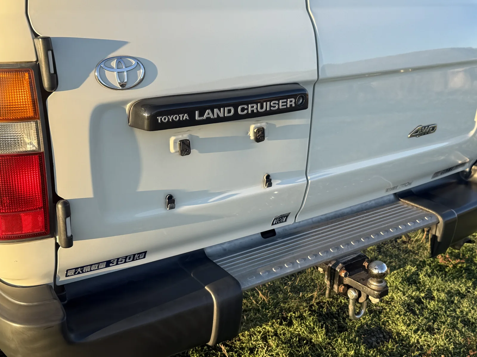 Toyota Land Cruiser badging and rear step on the HZJ81