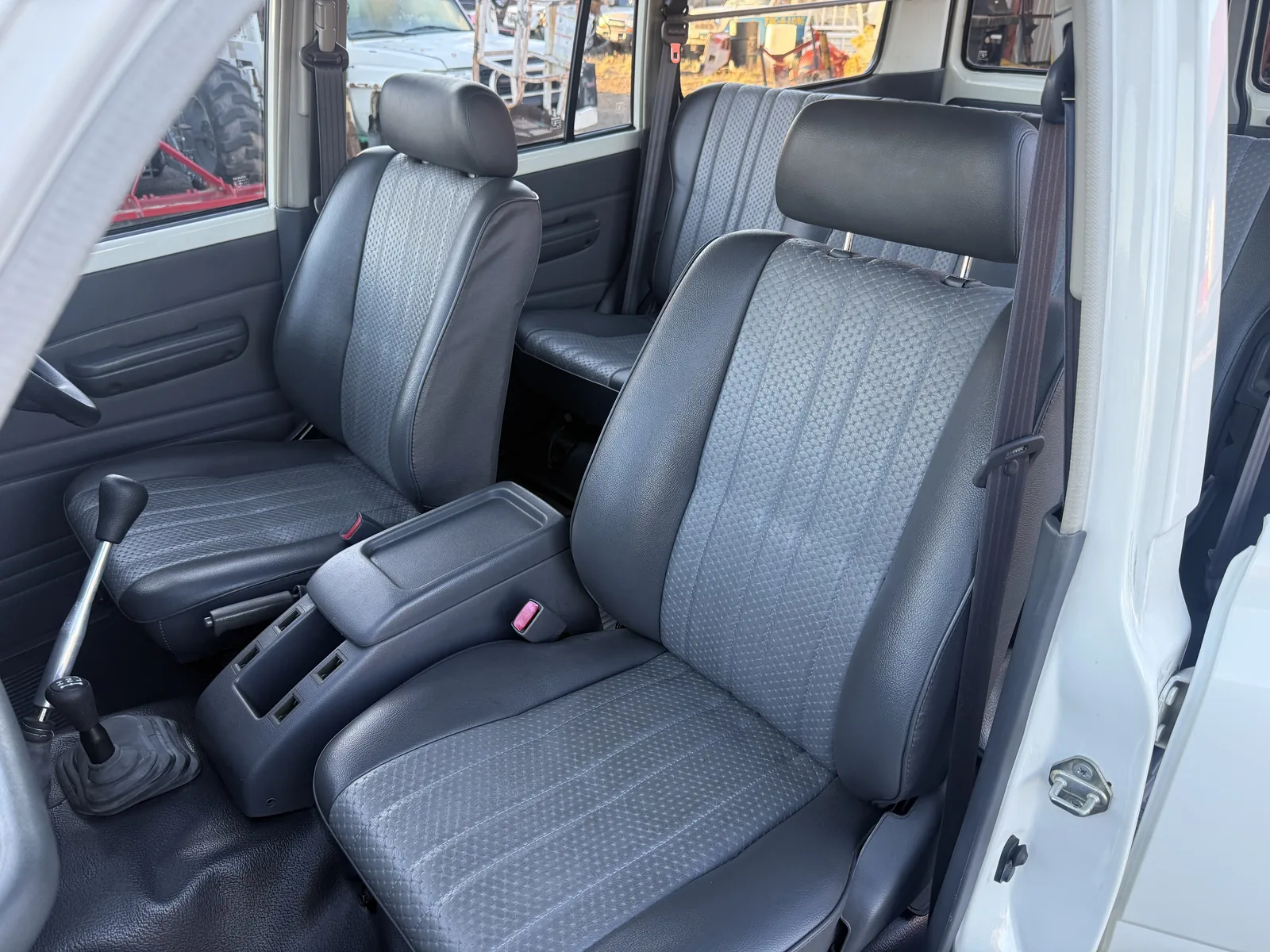 Front vinyl seating viewed through the passenger door