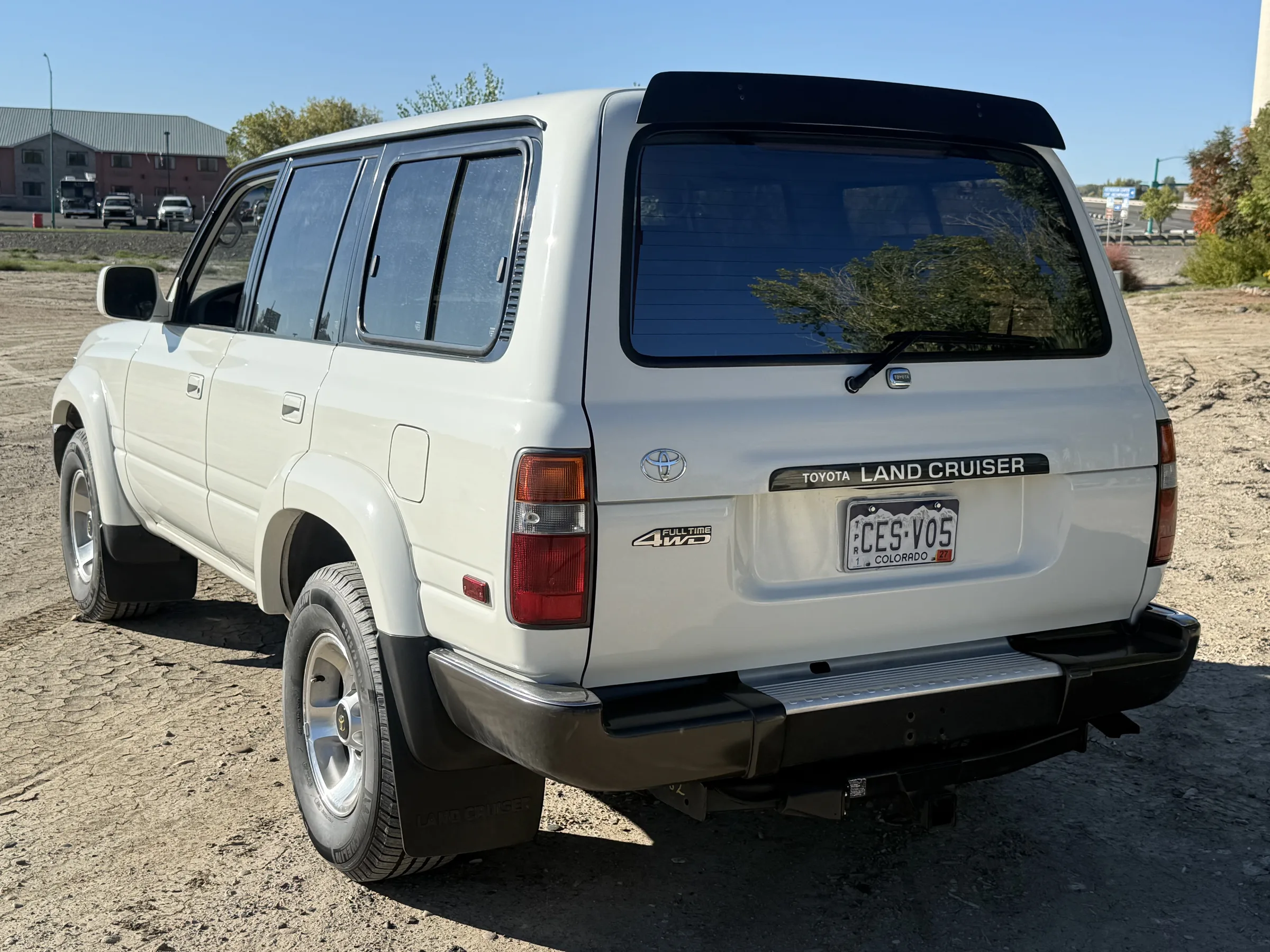 Rear driver-side view of the 1994 Toyota Land Cruiser FZJ80