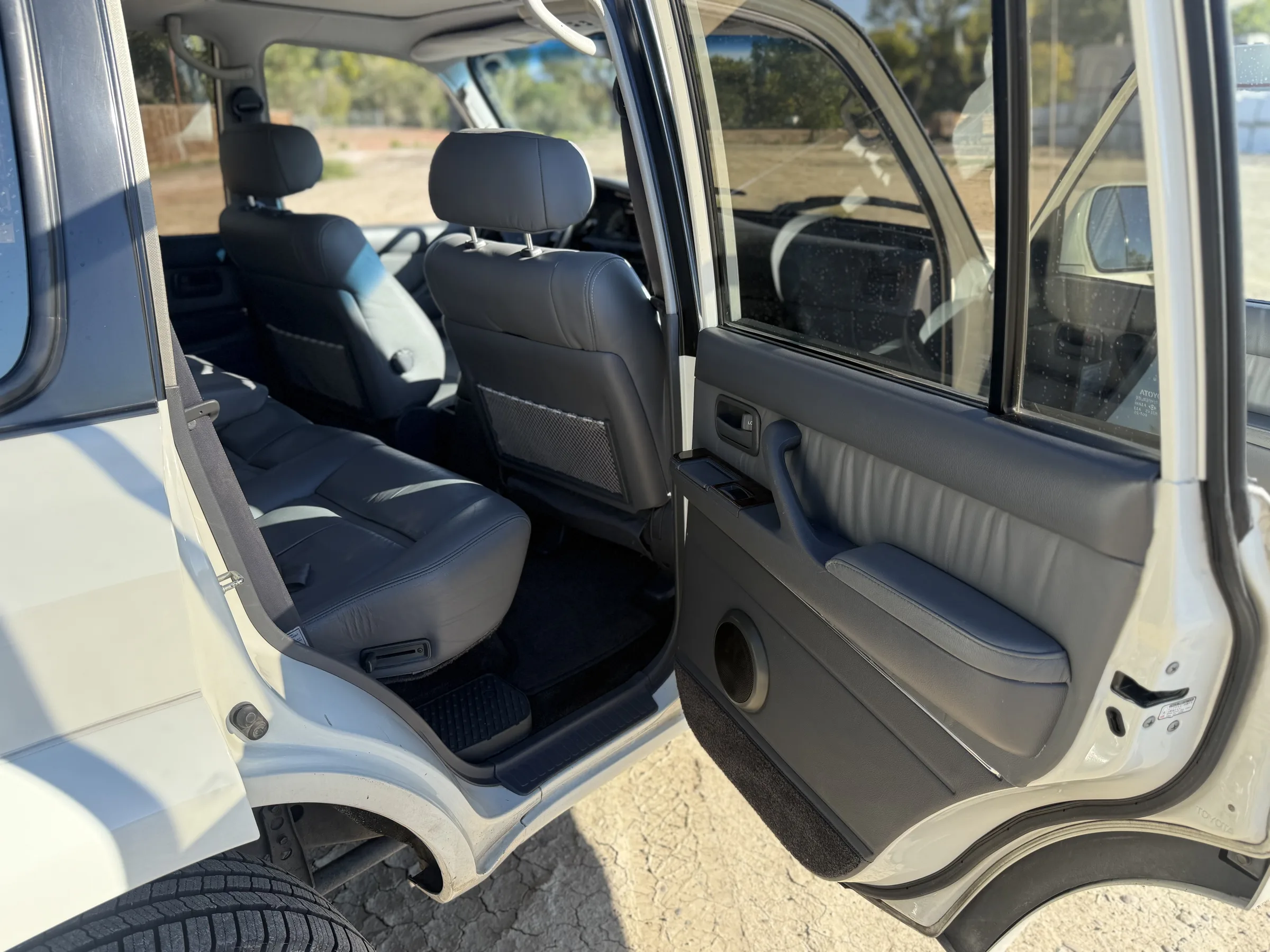 Open rear passenger-side door and second-row seating in the 1994 FZJ80