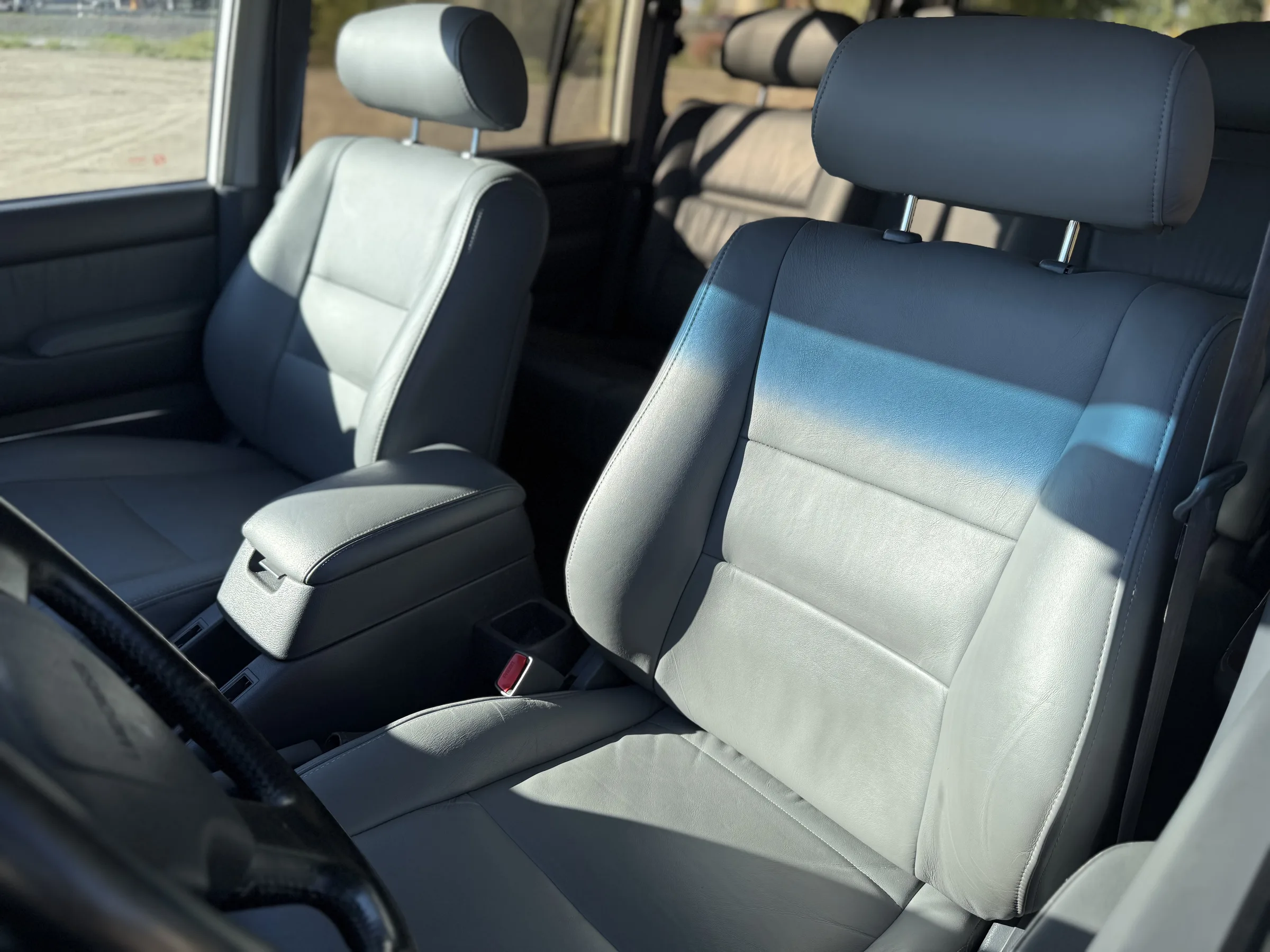 Gray leather front seats in the 1994 Toyota Land Cruiser FZJ80