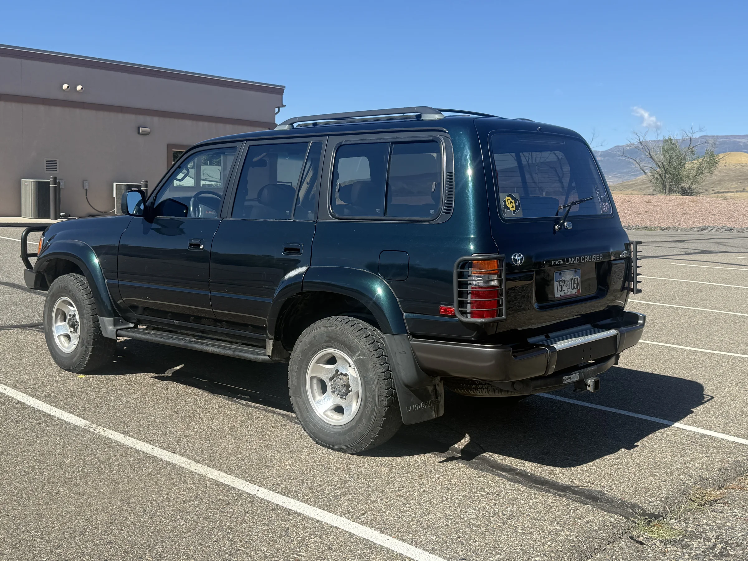 Rear three-quarter view of the 1996 Toyota Land Cruiser FZJ80