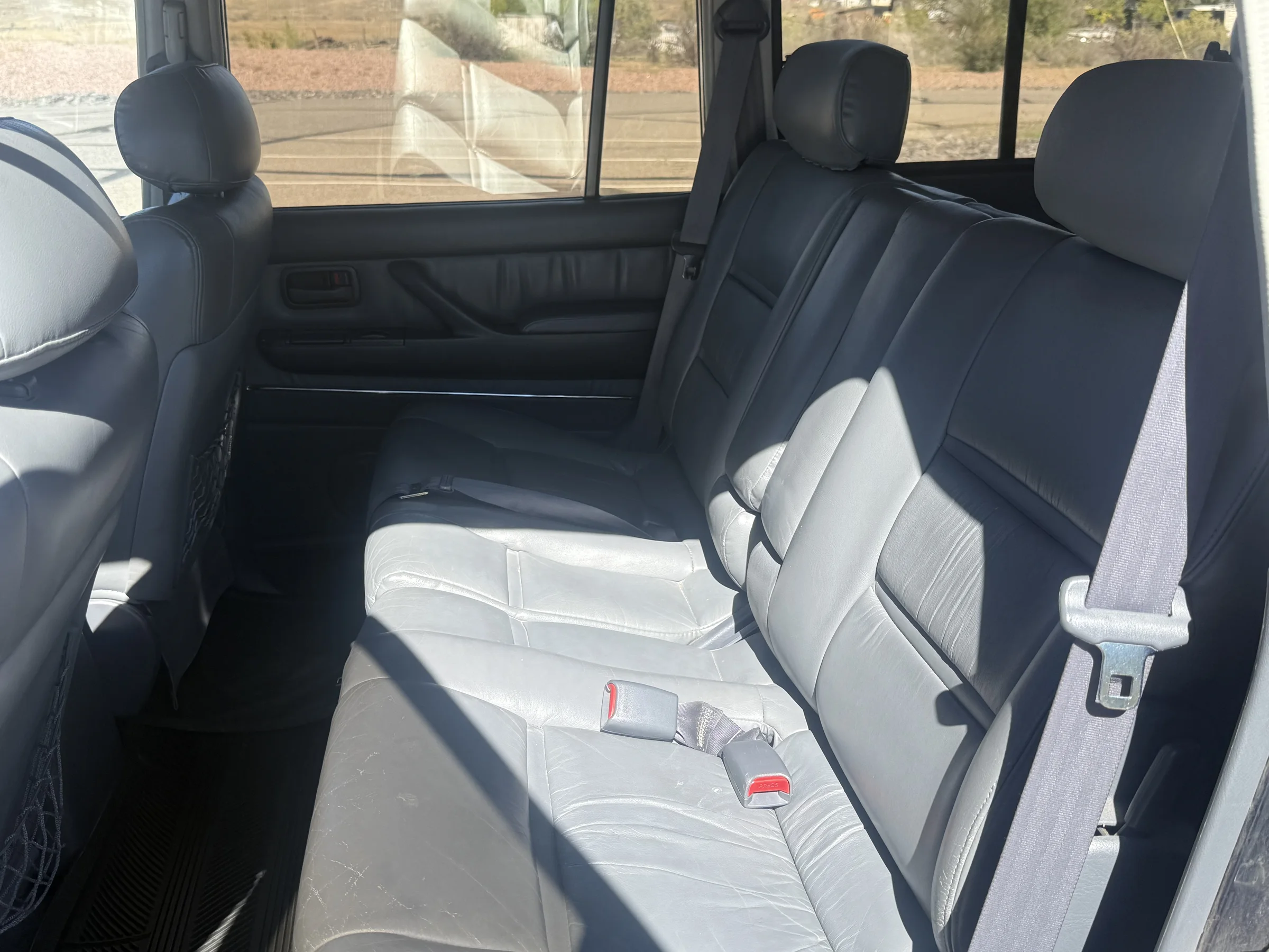 Factory leather second-row seats in the 1996 FZJ80