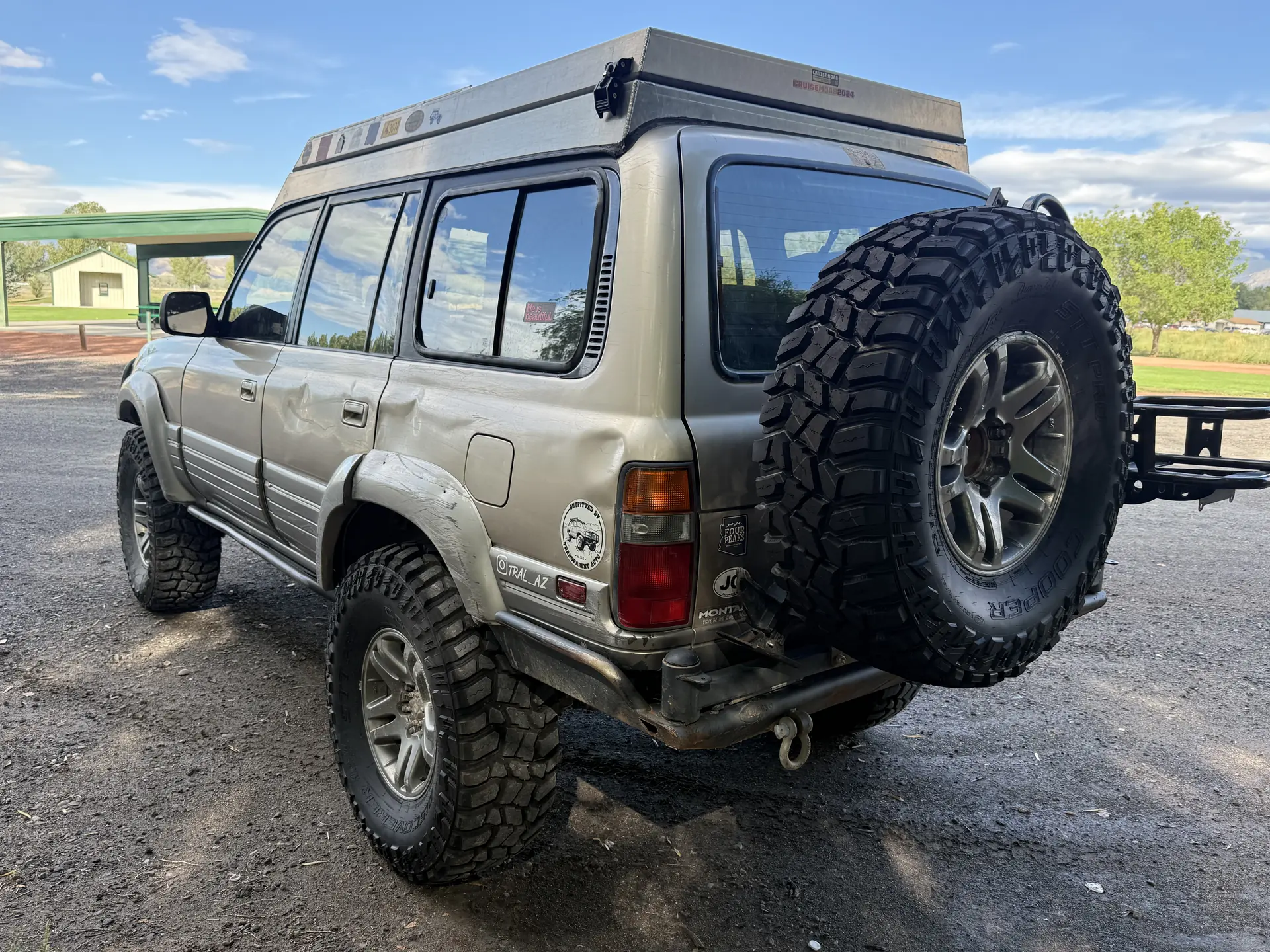Driver-side rear view of the 1997 Lexus LX450 with Campteq roof