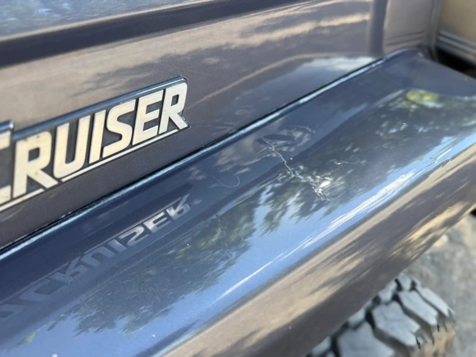 Paint condition near the Land Cruiser badge on the 1985 BJ73