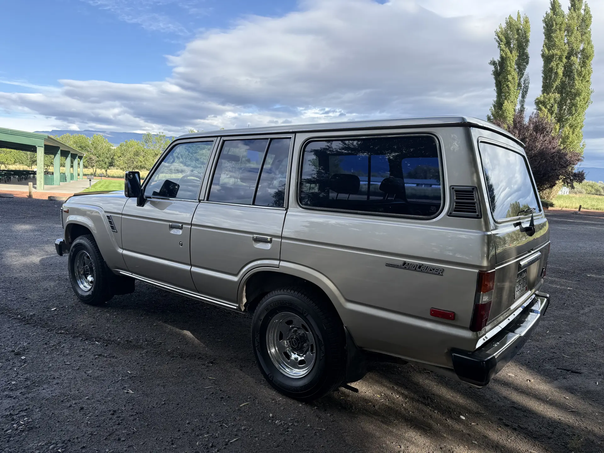 Rear driver-side exterior of the 1990 Toyota FJ62 Land Cruiser