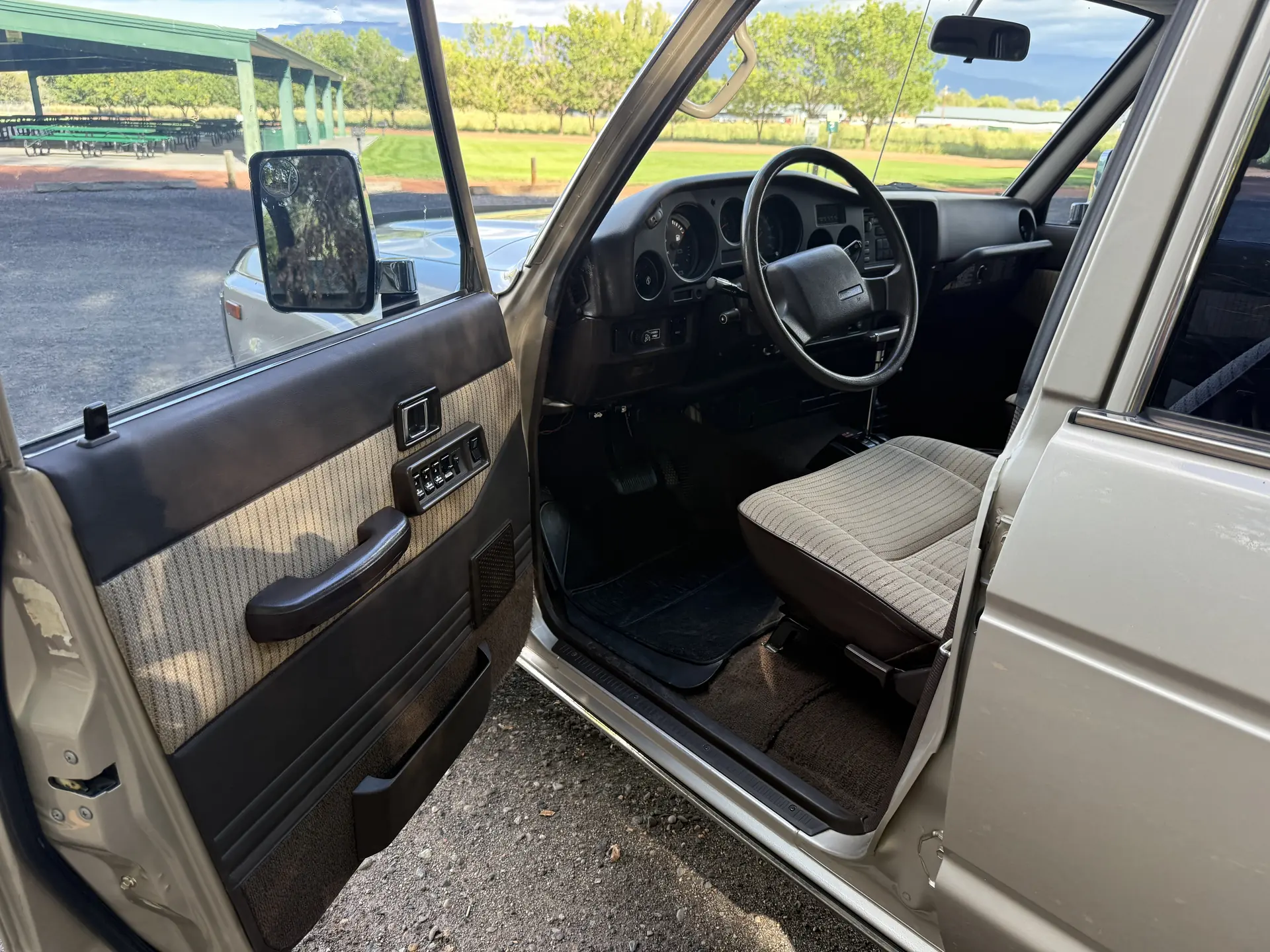 Open driver door, seat and steering wheel of the 1990 Toyota FJ62