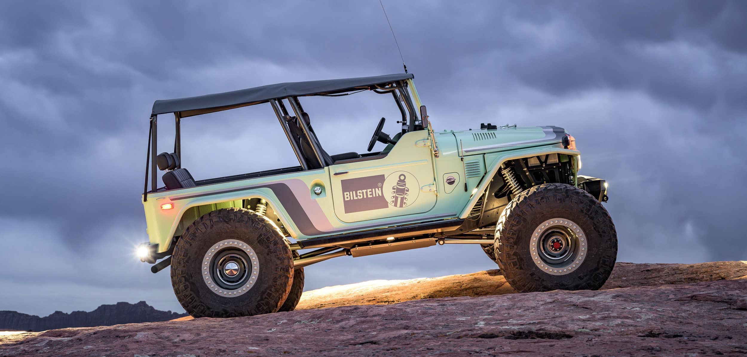 Proffitts shop crawler with clouds in background inclined up to the right.