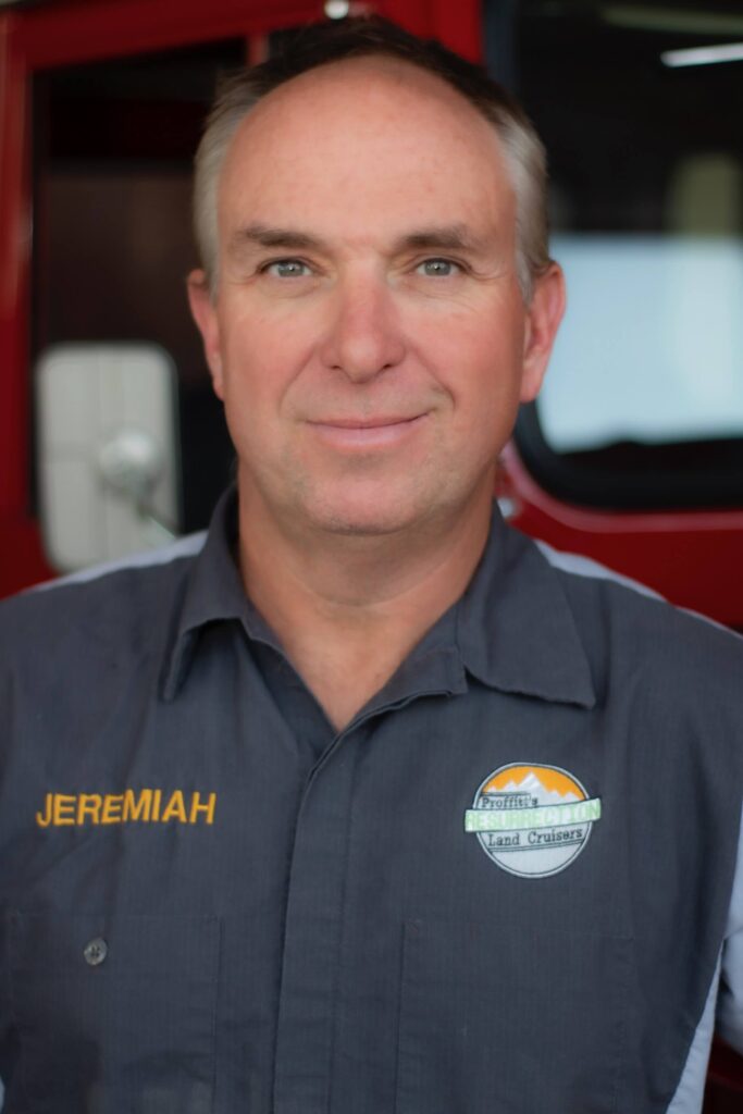 Jeremiah Proffitt, owner of Resurrection Land Cruisers. A photo of his head shot, smiling at the camera, with "Jeremiah" written on his shirt and the land cruisers logo on the other side.