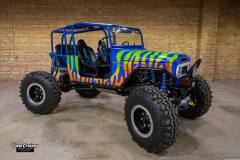 old photo of fj40 with blue and yellow stripes like a lizard